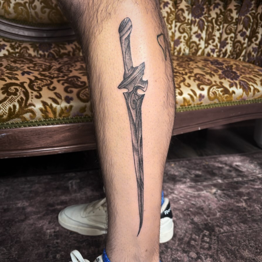 Sword black and grey tattoo on the forearm by Mary Hannah Sosdian