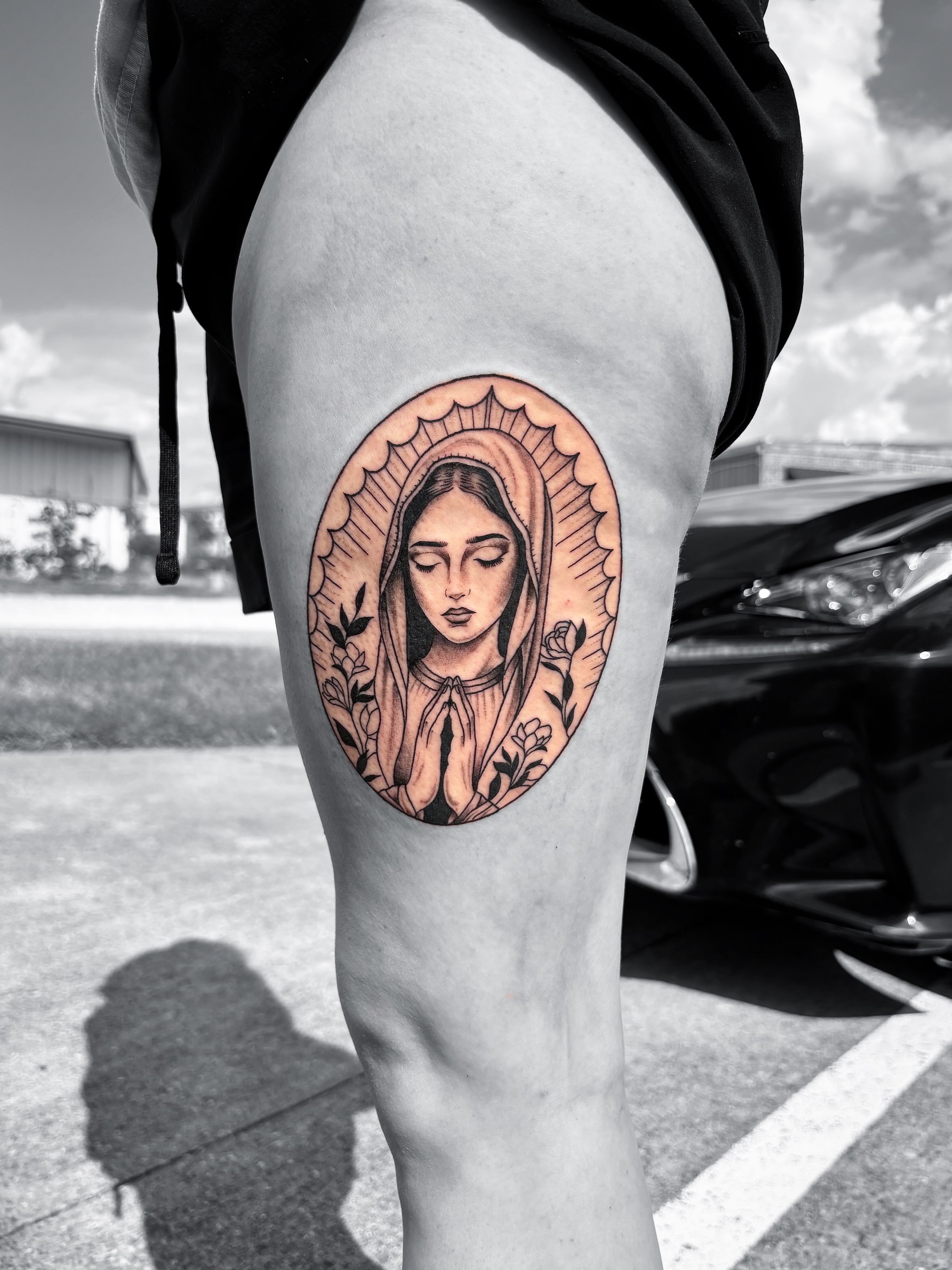 Religious figure realism tattoo on the thigh by Grace L