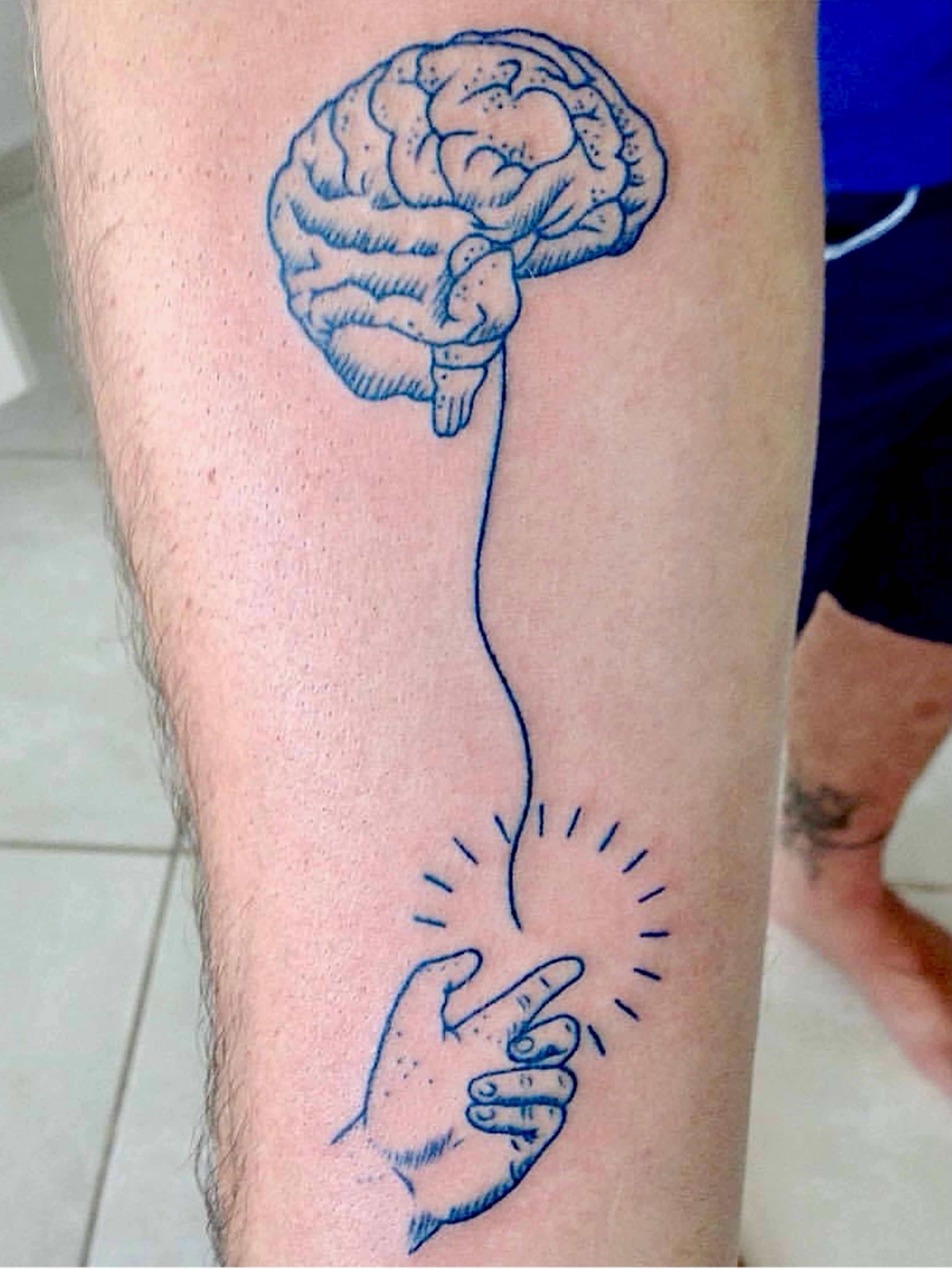Brain and hand dotwork tattoo on the forearm by @luckybunnytat2