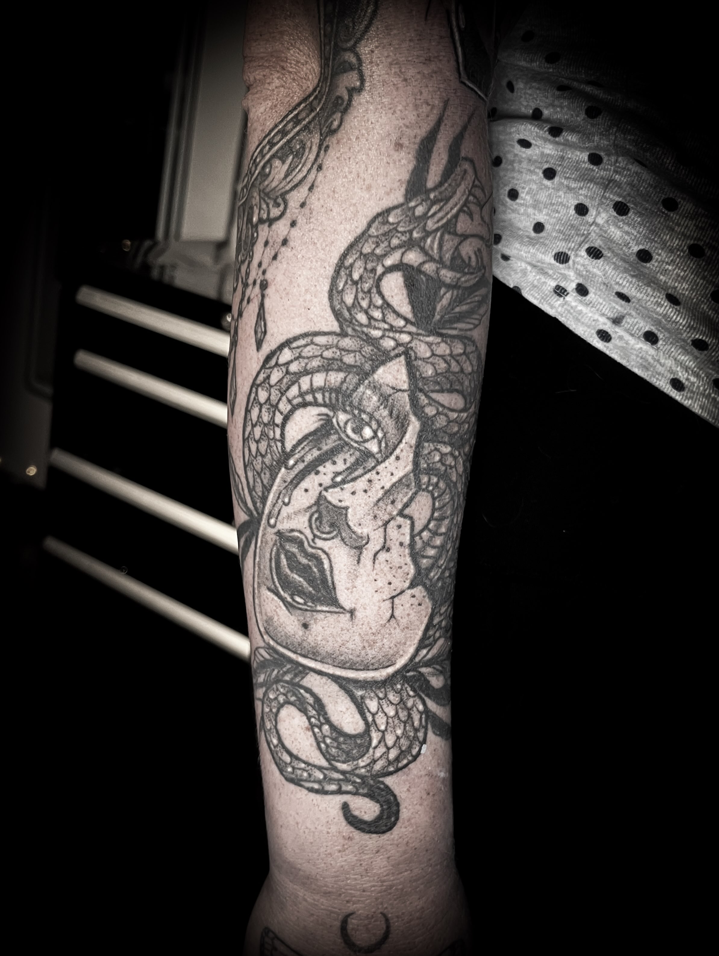 Woman with snake realism tattoo on the forearm by Lindsay Fernandez, Colorado Springs, Colorado