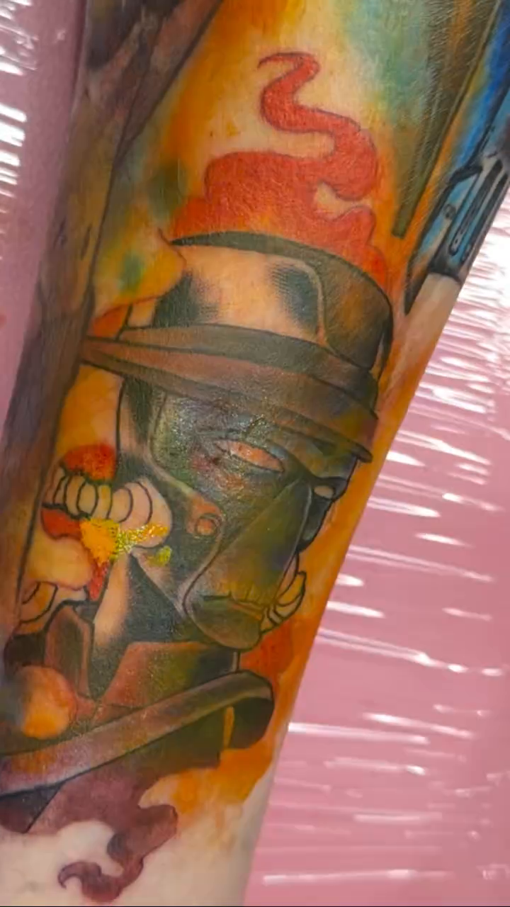 Clone Trooper helmet with flames surrealism tattoo on the forearm by Erin Peterson