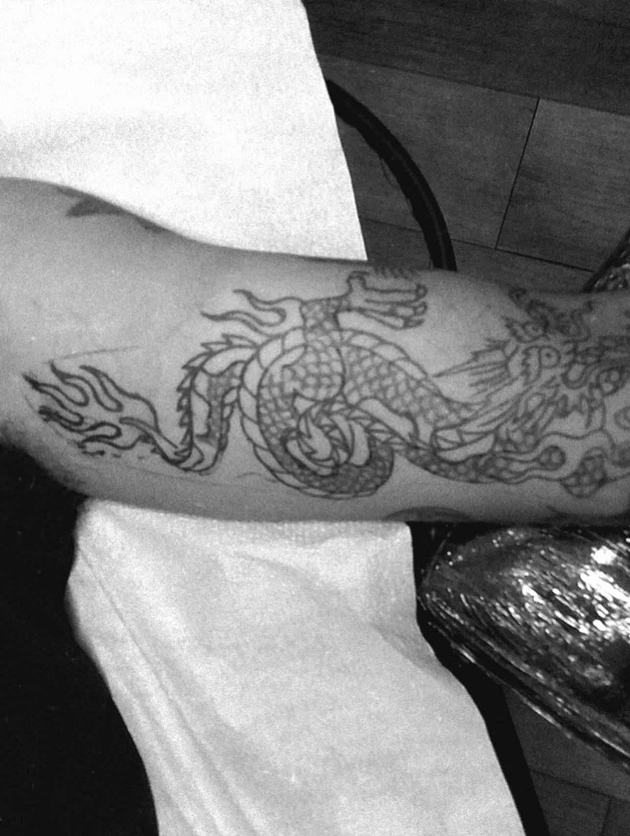 Dragon black and grey tattoo on the forearm by San Diego Tattoo Artist - 𝔍𝔞𝔠𝔬𝔟 𝔓𝔞𝔫𝔦𝔞𝔤𝔲𝔞
