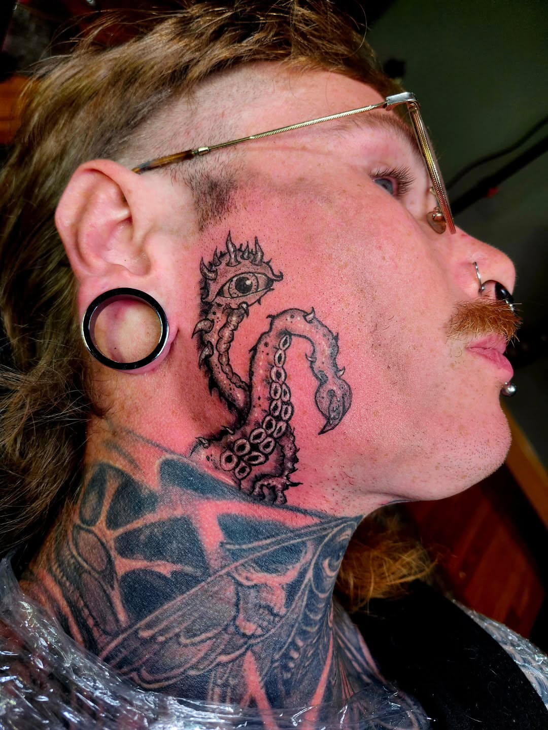 Octopus black and grey tattoo on the neck by @rockinr33d.tattoos