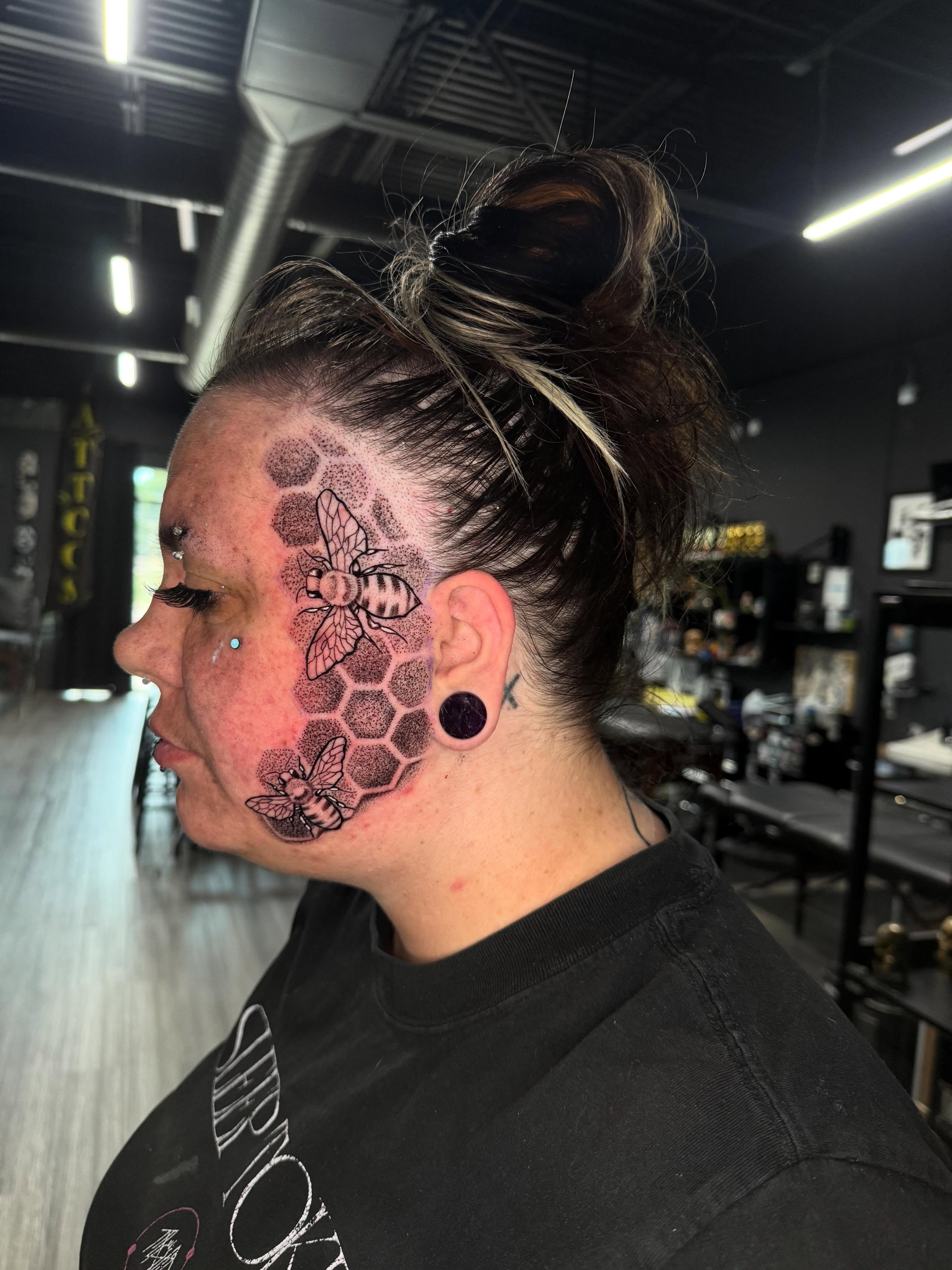 Bees and honeycomb dotwork tattoo by Adrián Banuelos