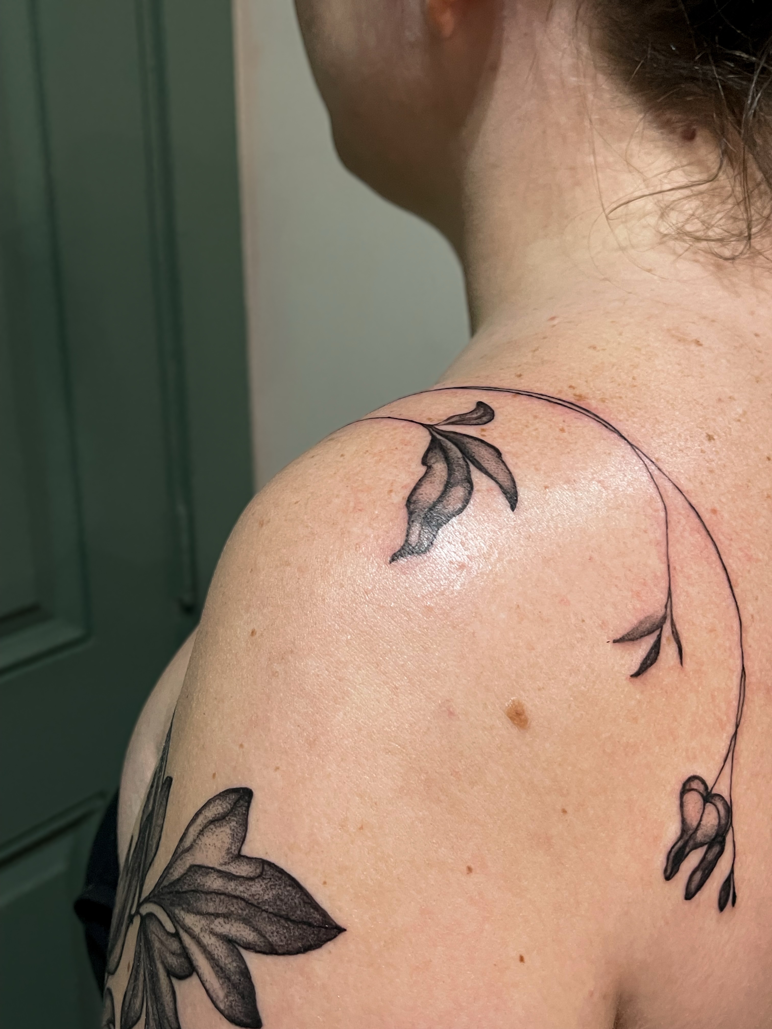 Flower vine black and grey tattoo on the shoulder by Amy