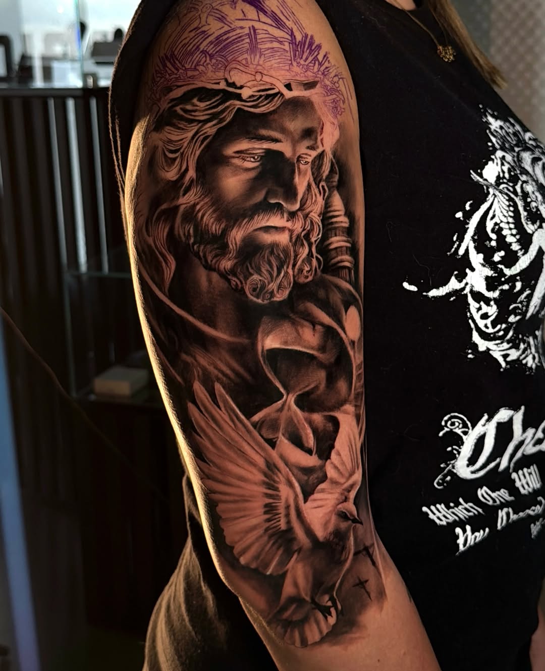 Religious figure with dove realism tattoo on the forearm by Diego Andrés Cárdenas