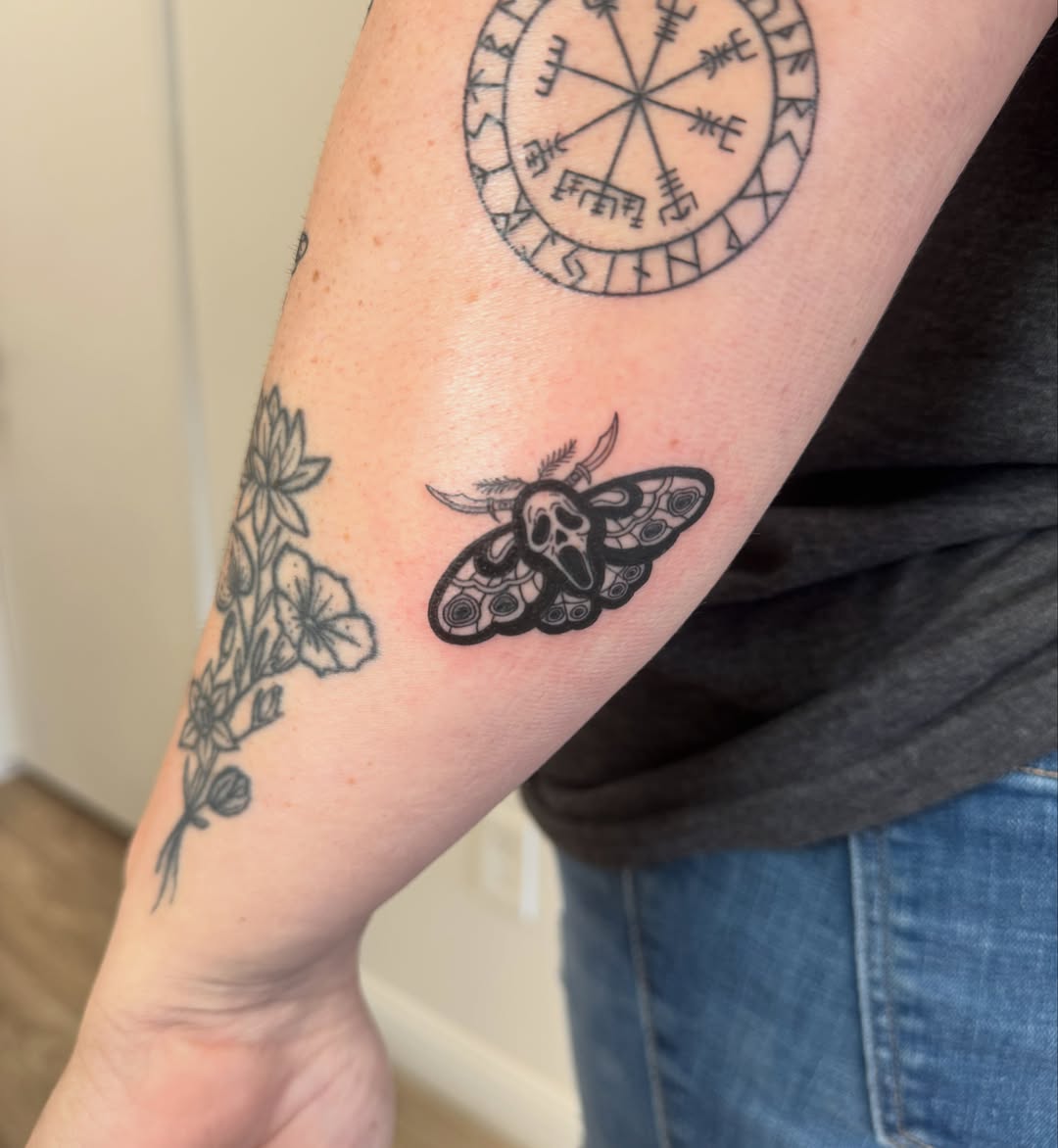 Moth black and grey tattoo on the forearm by Angela Nery, South Jordan, Utah