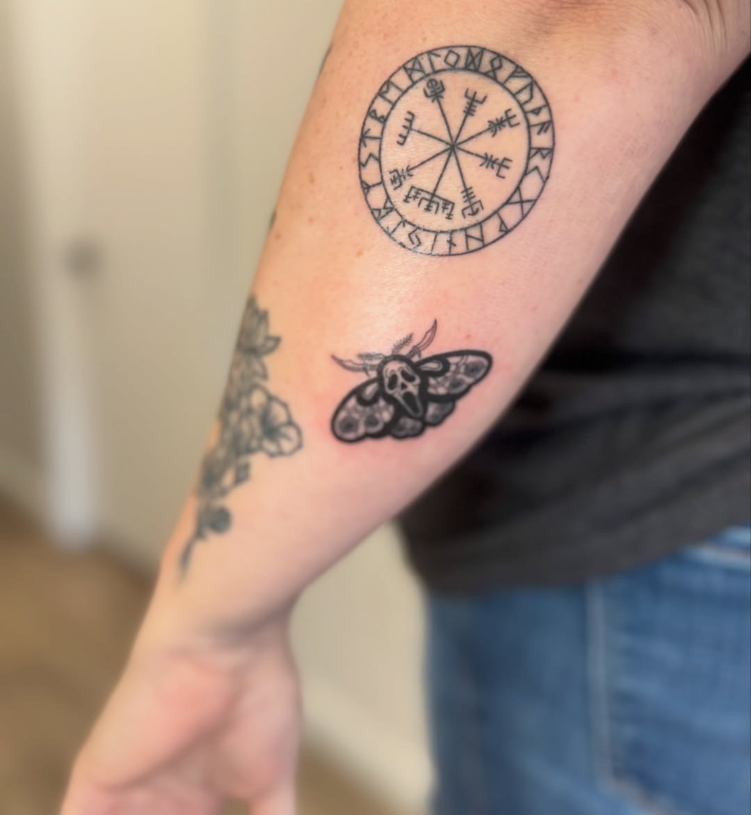 Vegvisir and moth black and grey tattoo on the forearm by Angela Nery, South Jordan, Utah