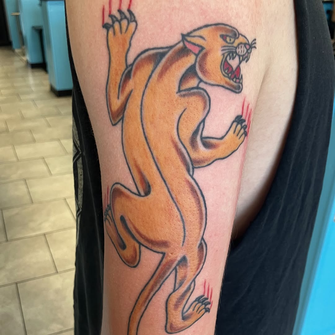 Panther realism tattoo on the forearm by Bryant Johnson