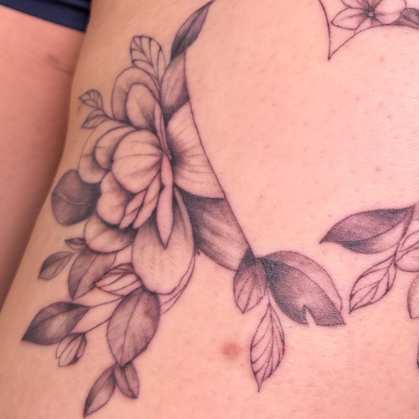 Floral bouquet black and grey tattoo on the thigh by PxINK, Crystal, Minnesota