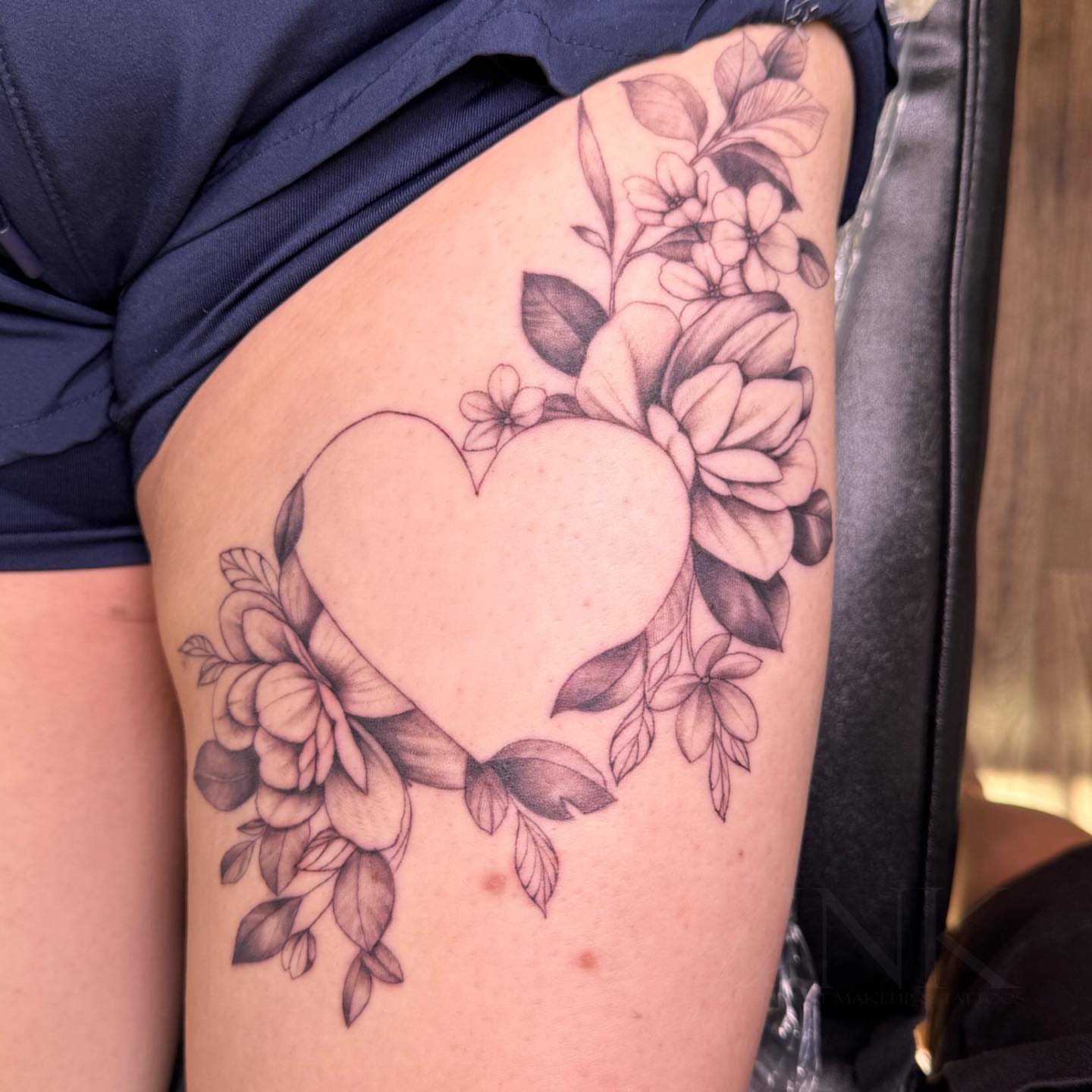Heart with floral border black and grey tattoo on the thigh by PxINK, Crystal, Minnesota