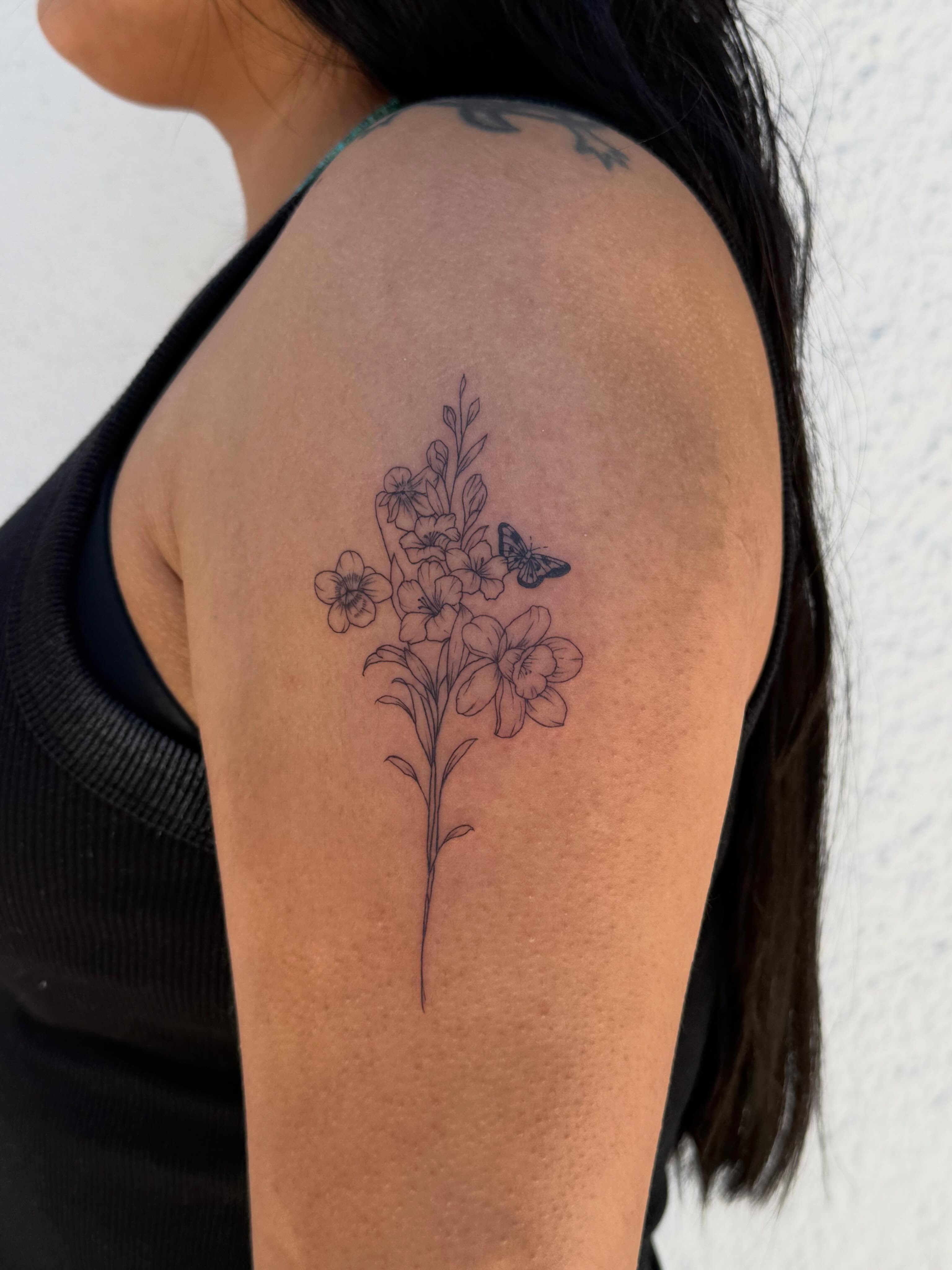 Flowers and butterfly black and grey tattoo on the shoulder by TATTOO & PIERCING ARTIST ₊˚⊹ ᰔ