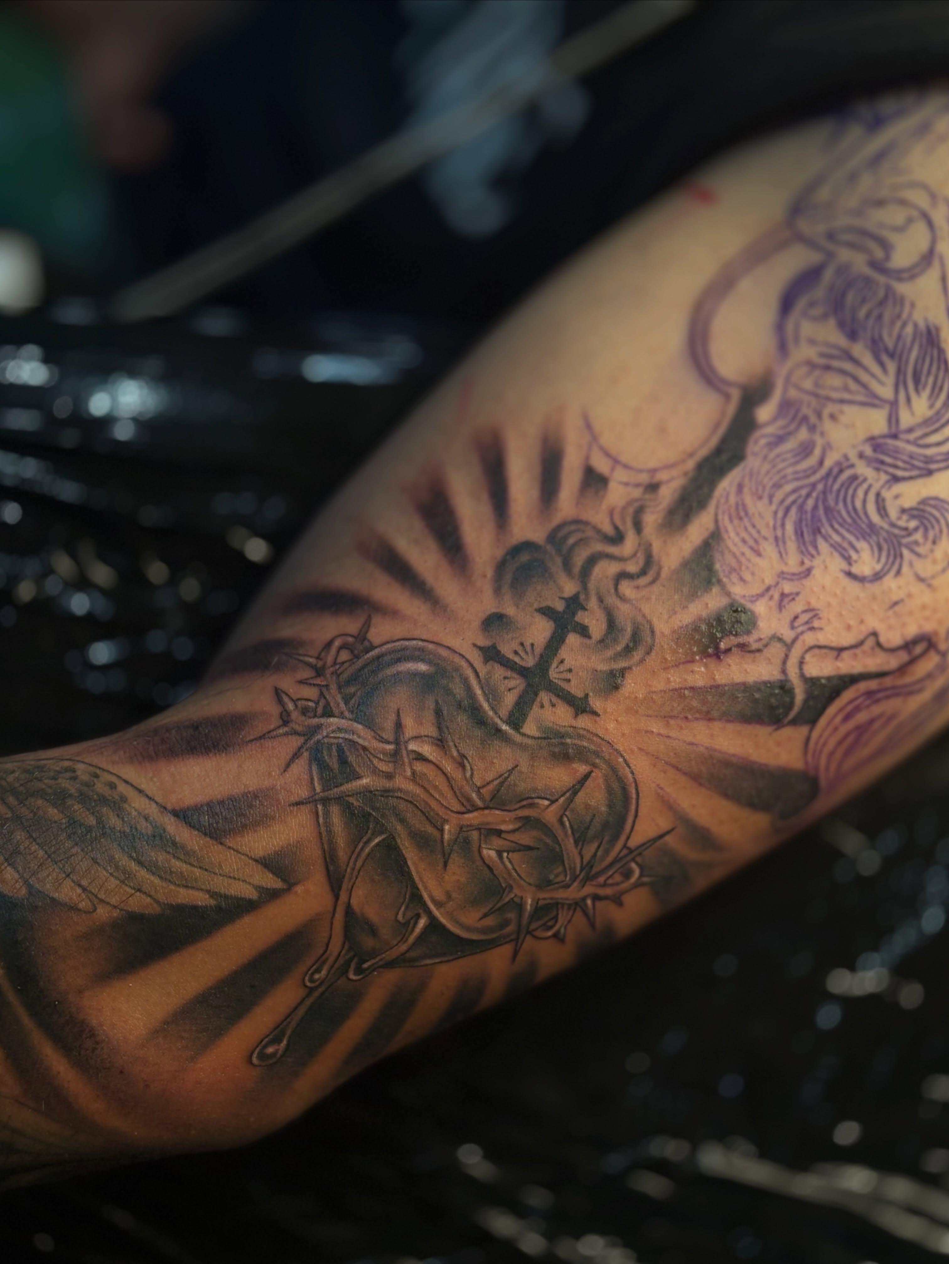 Heart with crown of thorns black and grey tattoo on the forearm by Kevin