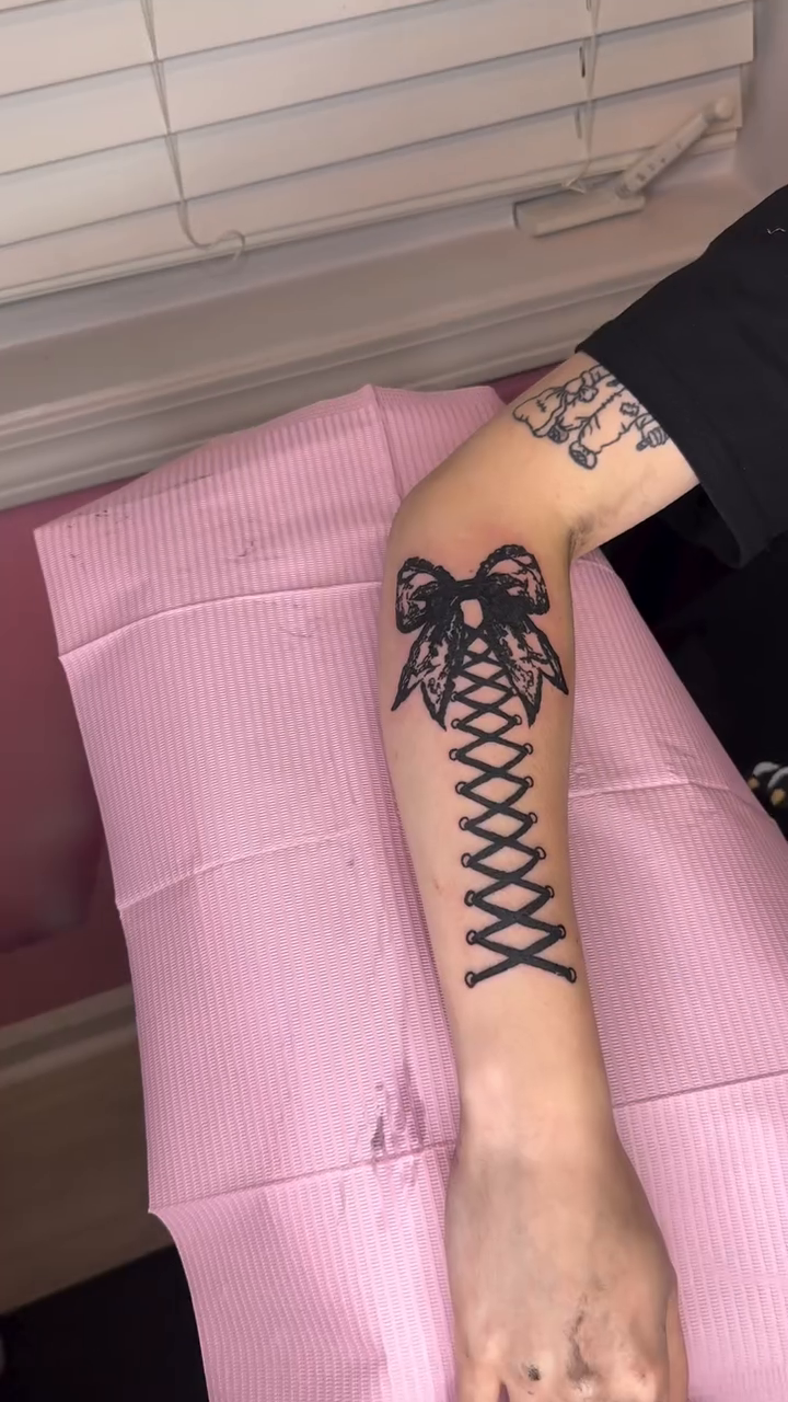 Corset lacing with a bow cyber sigilism tattoo on the leg by Room 707 Tattoo 🍰🍓