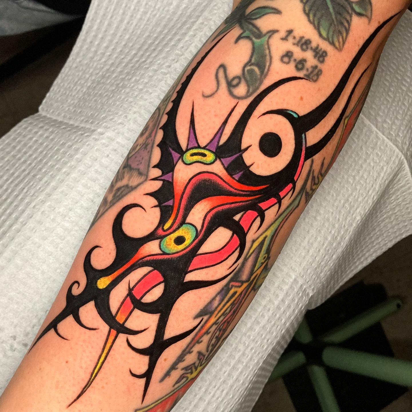 Abstract face tribal tattoo on the forearm by 🌴Nick Hetzel🌴, Saint Petersburg, Florida