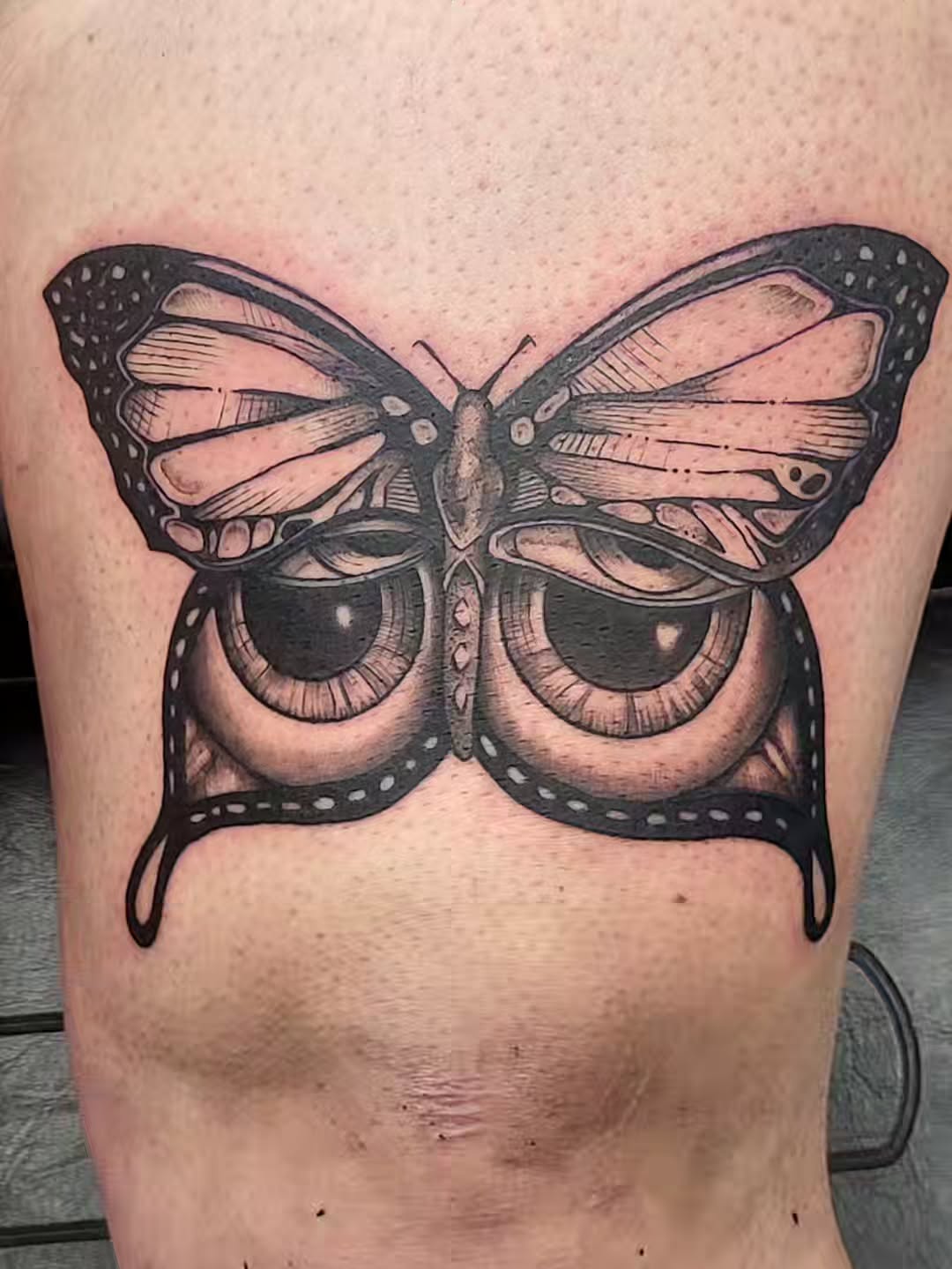 Butterfly with eyes fine line tattoo on the thigh by TEA ☕️ Tattoos