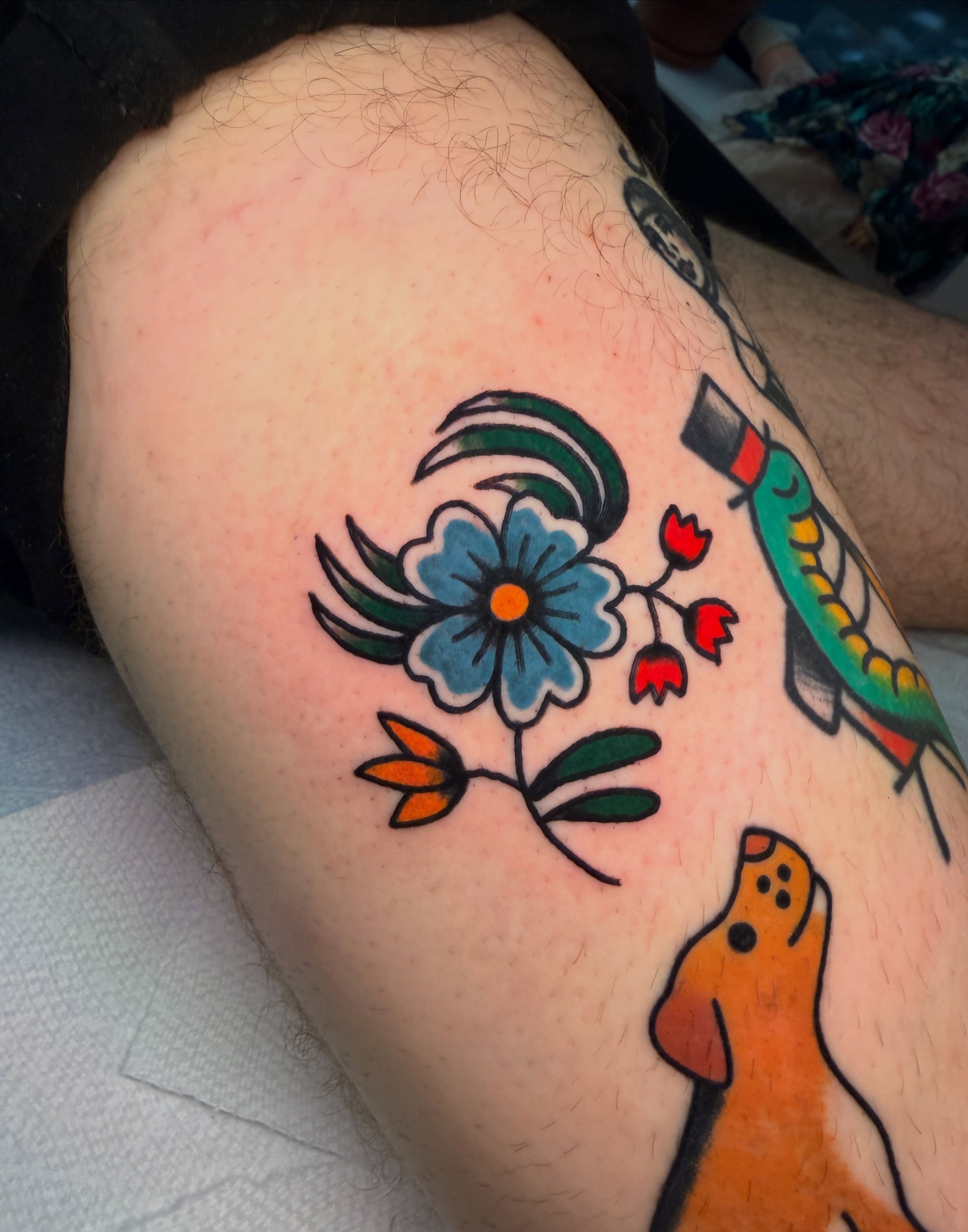 Flower and bird American traditional tattoo on the thigh by Emma Fox Tattoo