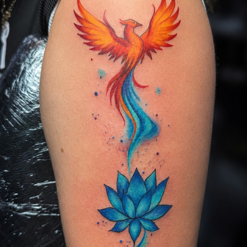 Phoenix and lotus flower watercolor tattoo on the thigh by PMU Artist