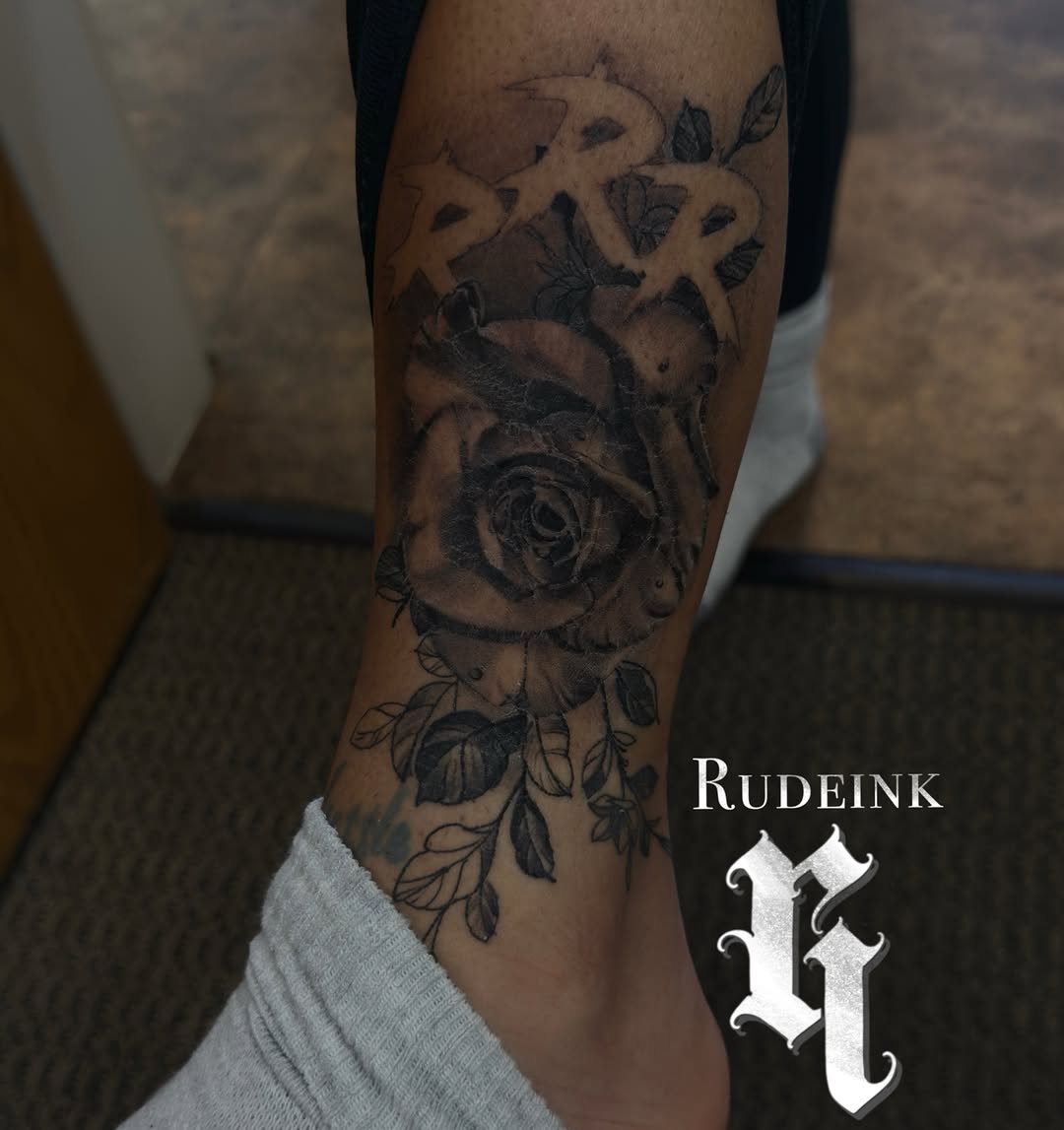 Rose realism tattoo on the forearm by Eric RudeInk
