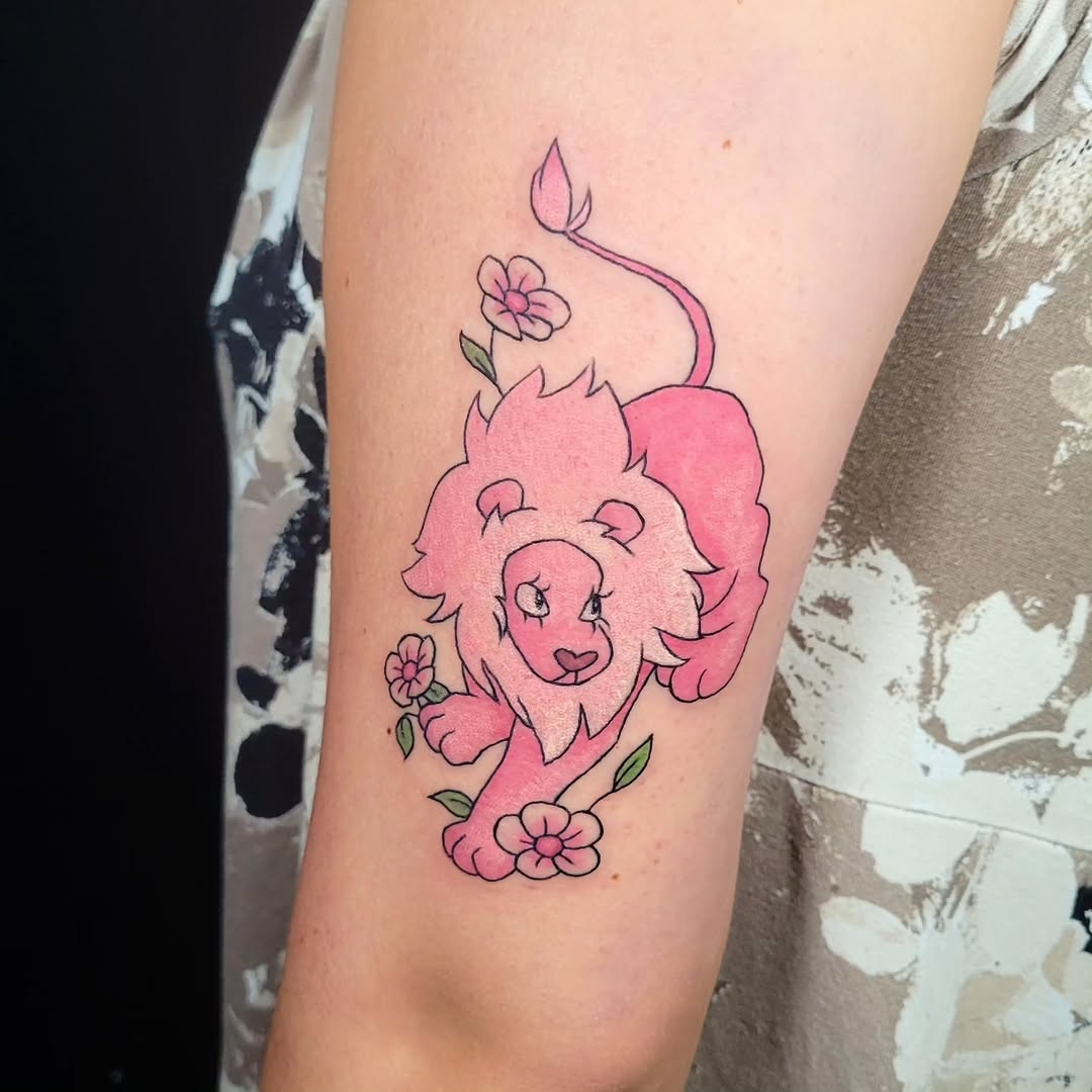 Pink lion with flowers new school tattoo on the forearm by Sarah Alba