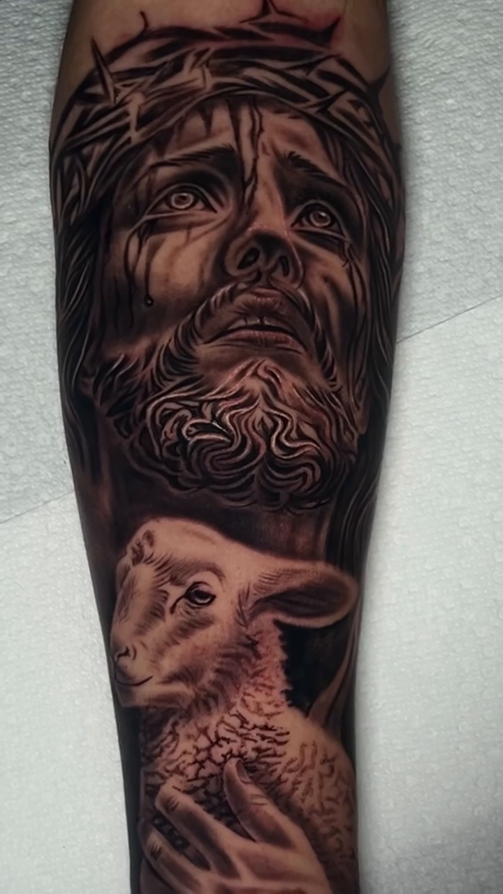 Jesus Christ and a lamb realism tattoo by Kevyn Vidal