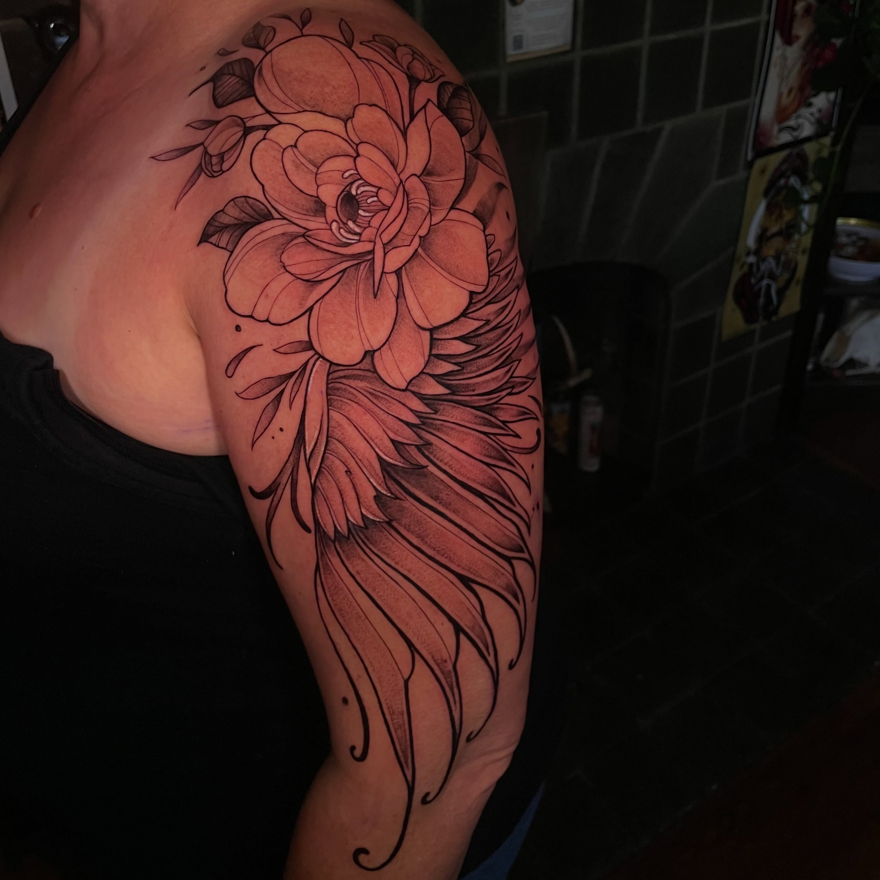 Peony and wing black and grey tattoo on the shoulder by Lauren Sisouphanh, Canton, Ohio