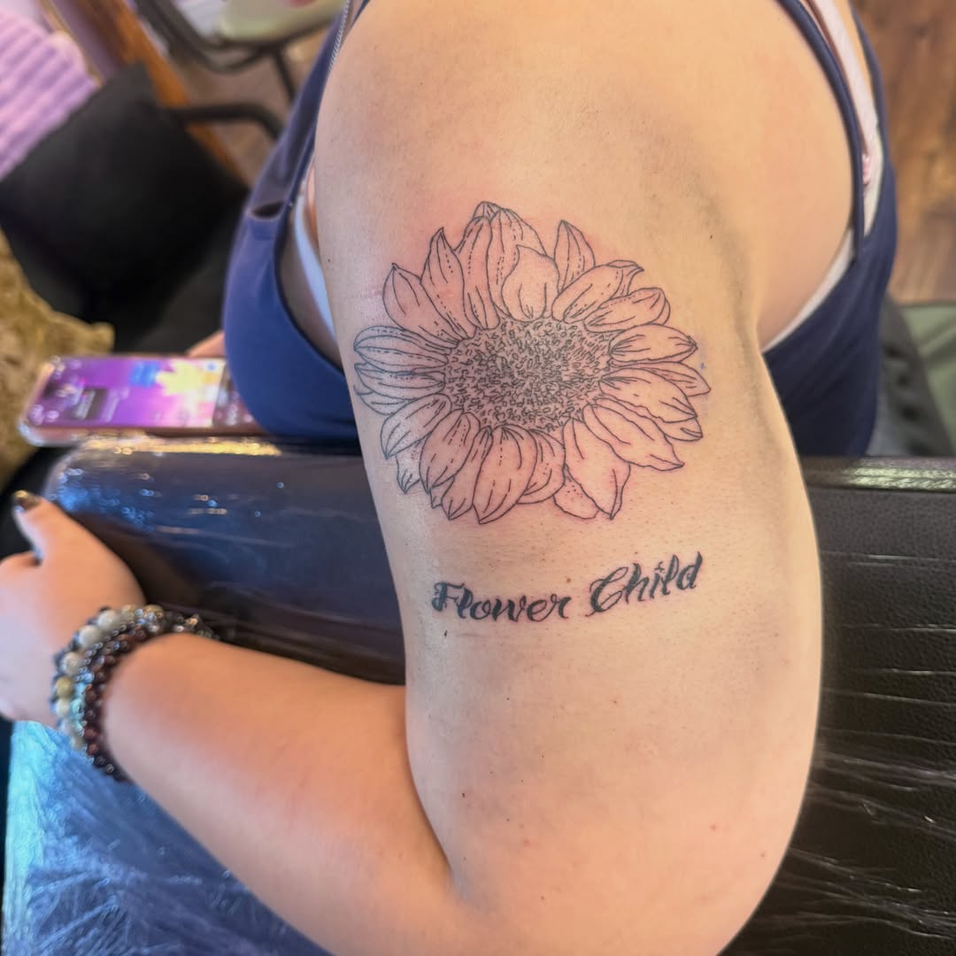Sunflower dotwork tattoo on the forearm by Jay