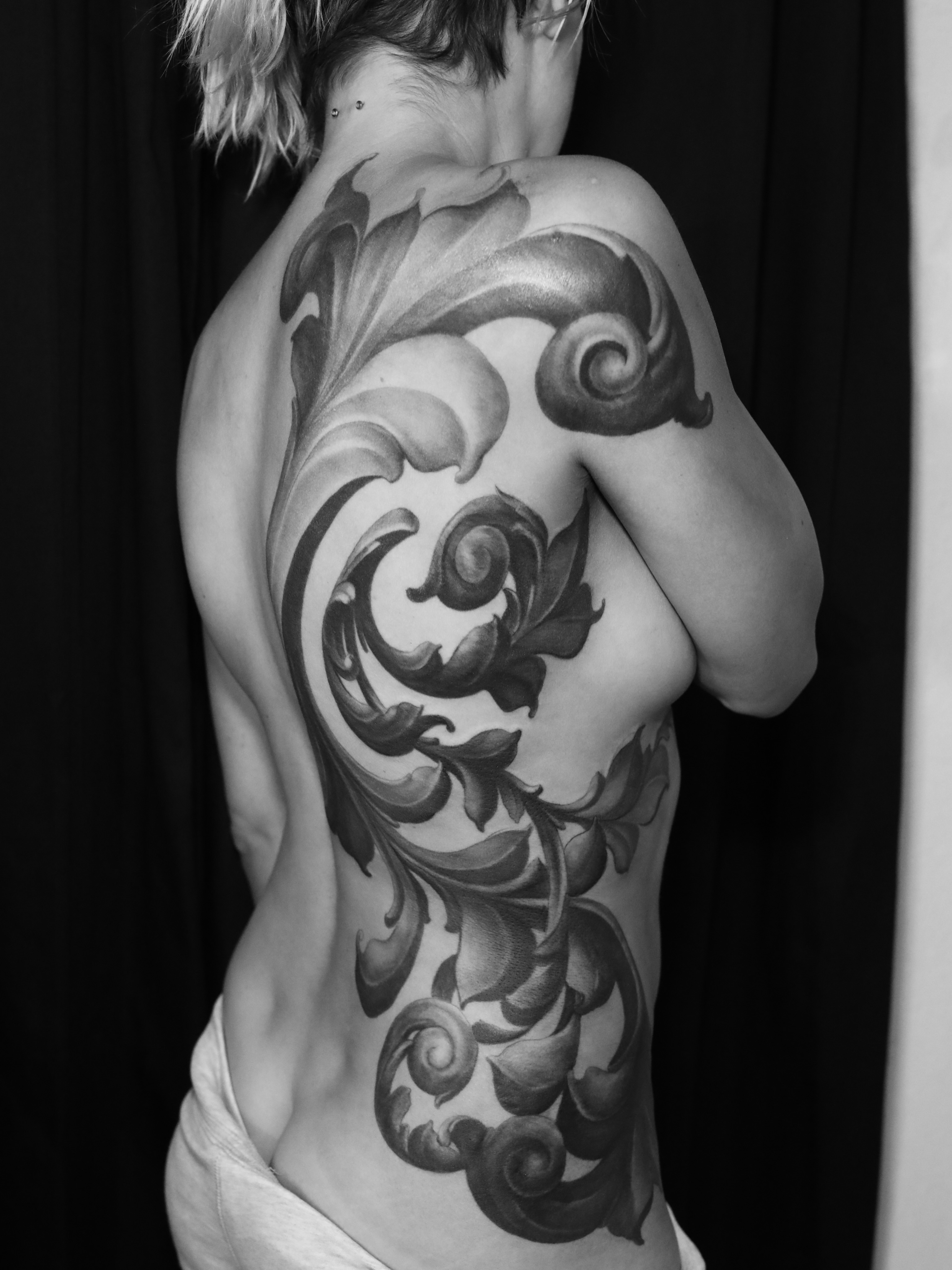 Scrollwork ornamental tattoo on the back by ➕d U S T I N C H A R L e S➕, Seattle, Washington