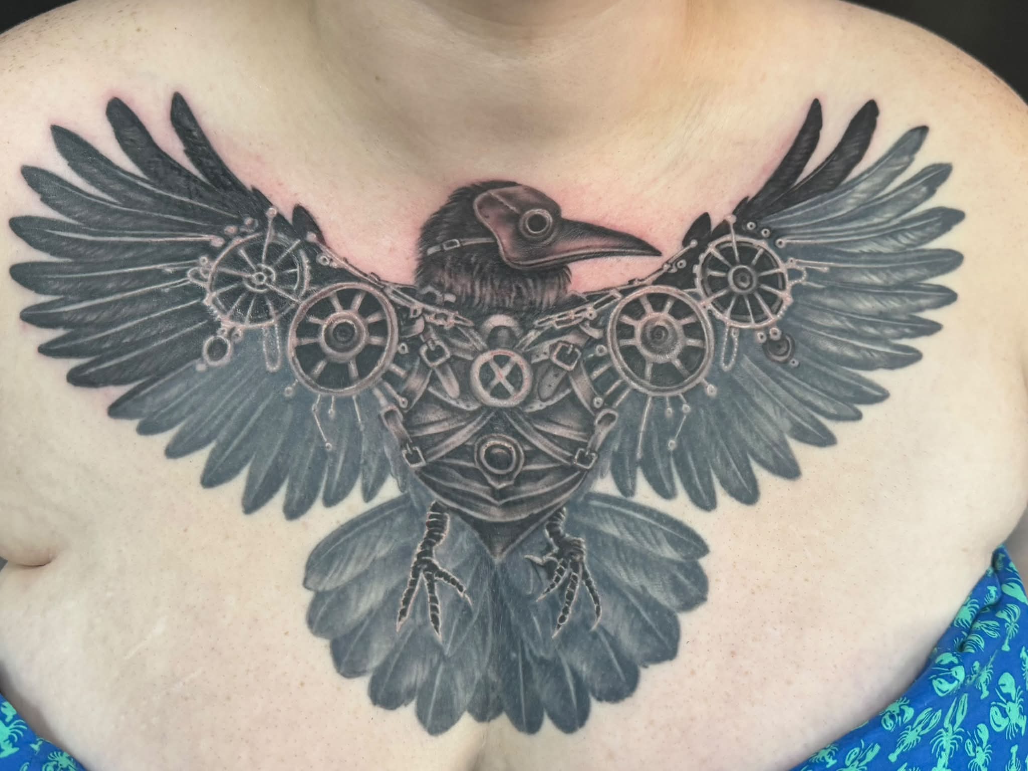 Crow tattoo on the chest by Skott Kautman, Dubuque, Iowa