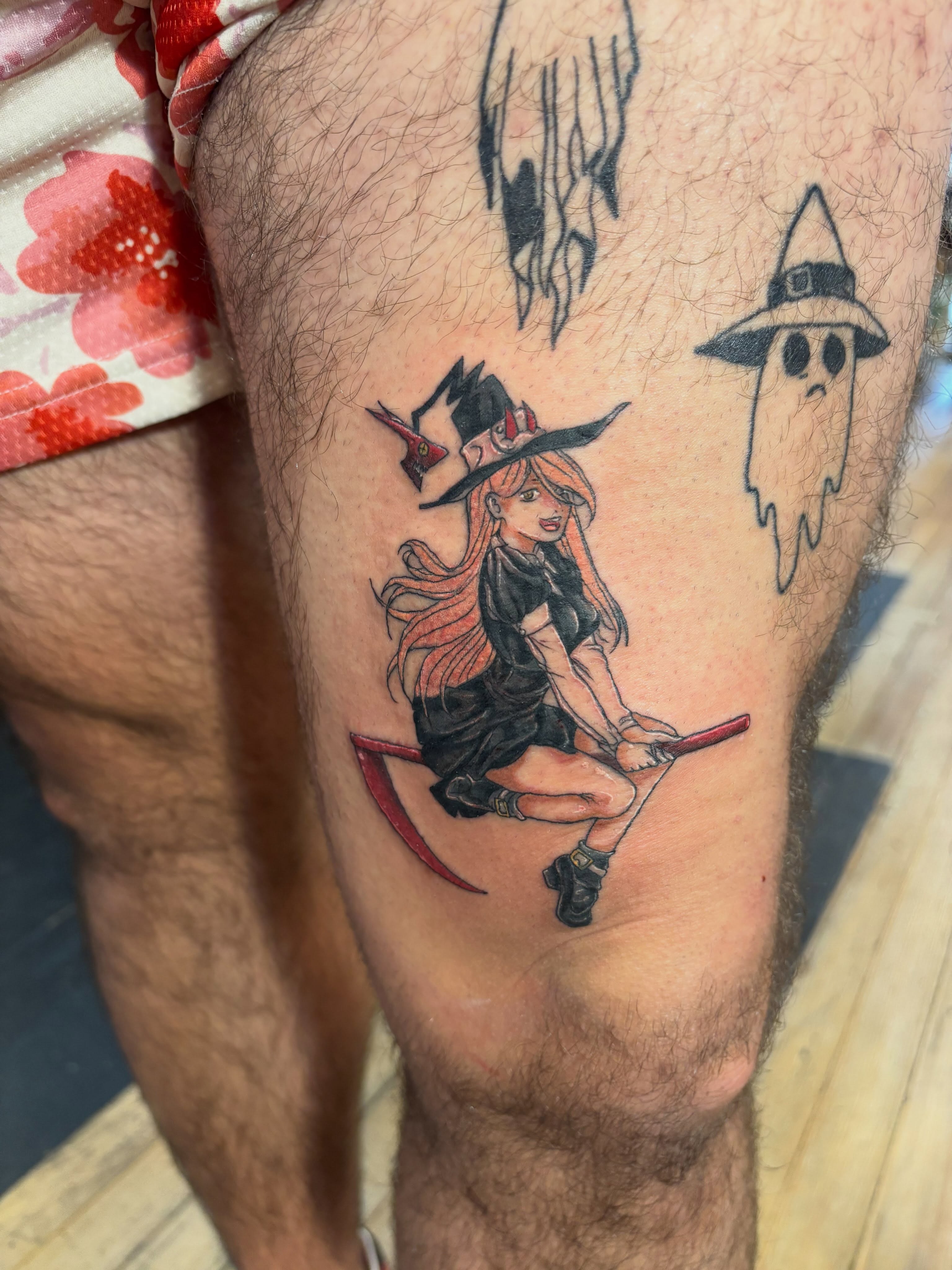 Witch riding broomstick illustrative tattoo on the thigh by Aubri Aunna
