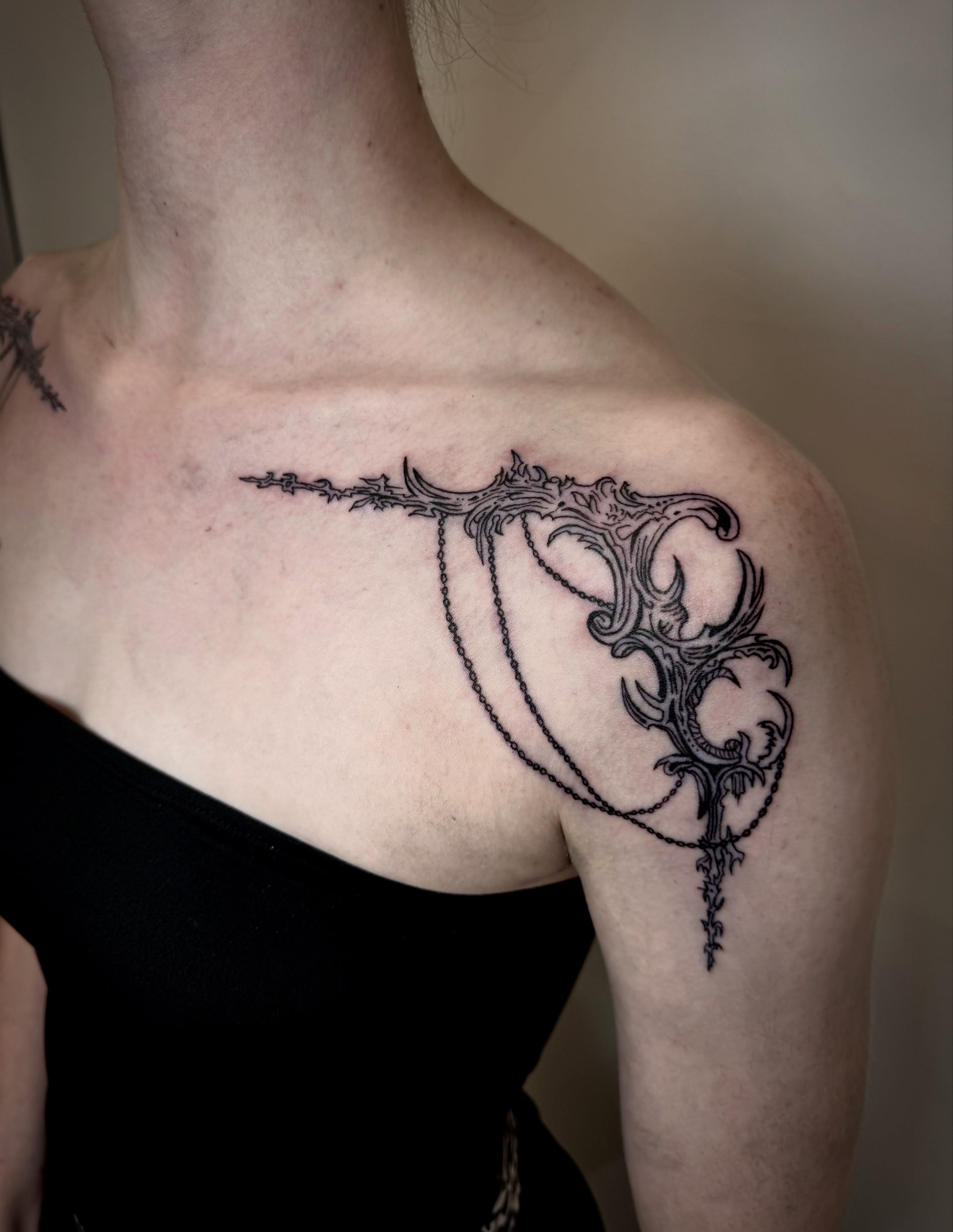 Ornate key black and grey tattoo on the shoulder by dev
