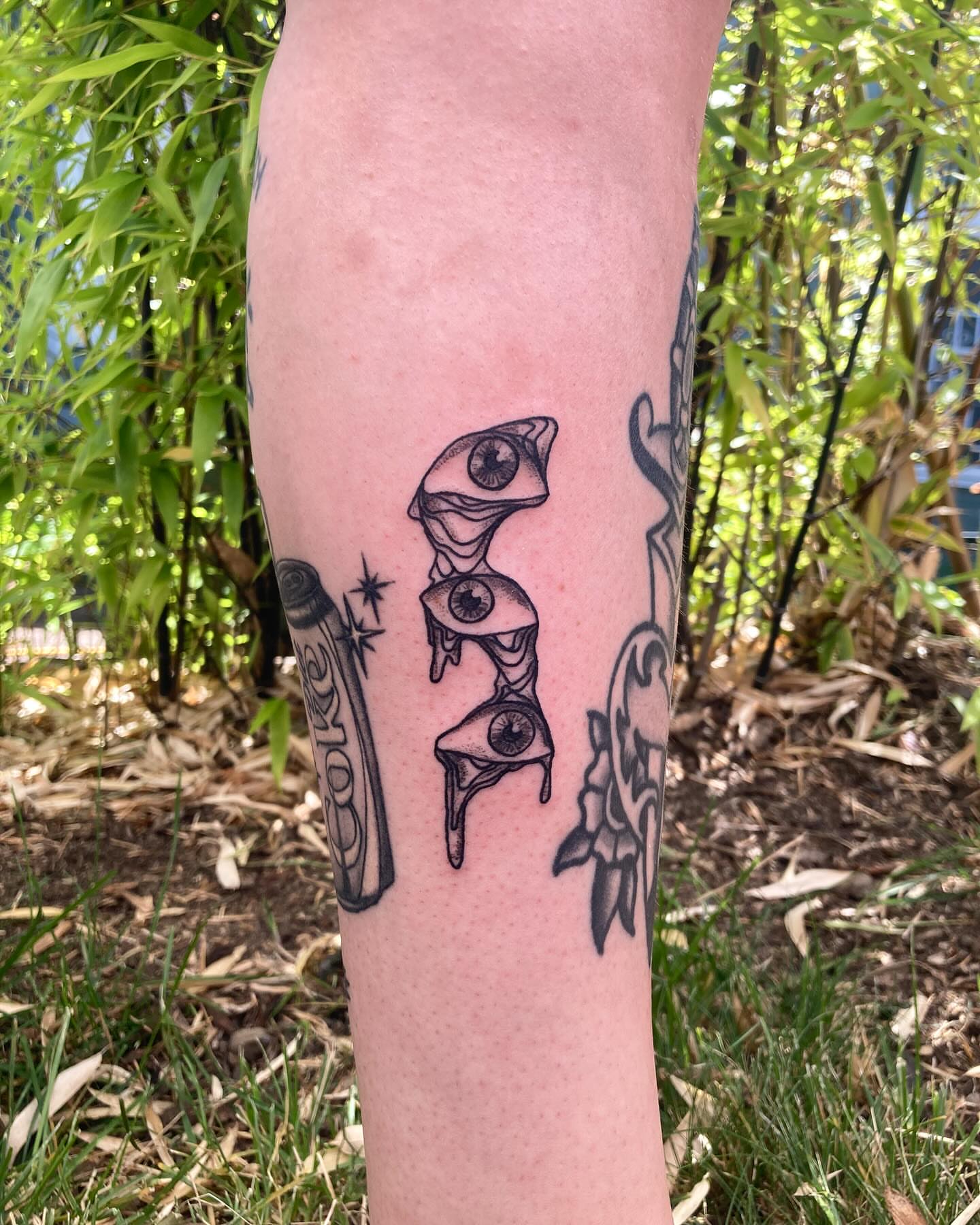 Eyes and hourglass geometric tattoo on the forearm by james <3