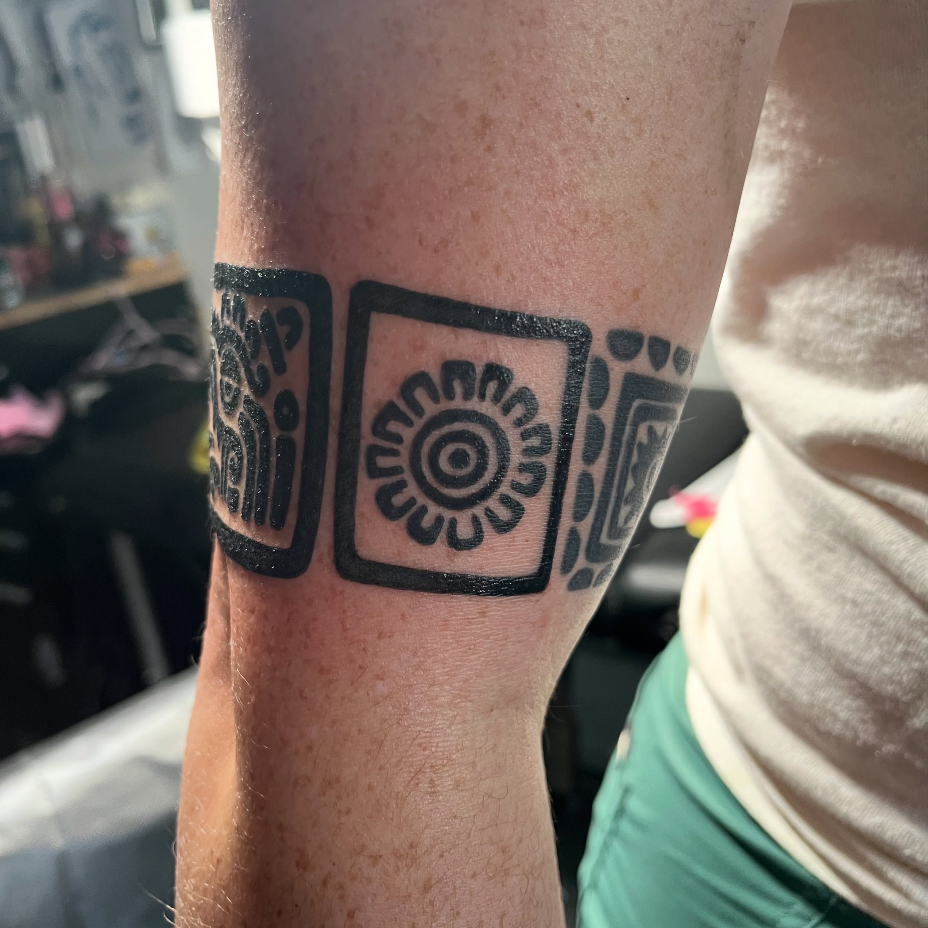 Sunburst geometric tattoo on the forearm by christina diaz