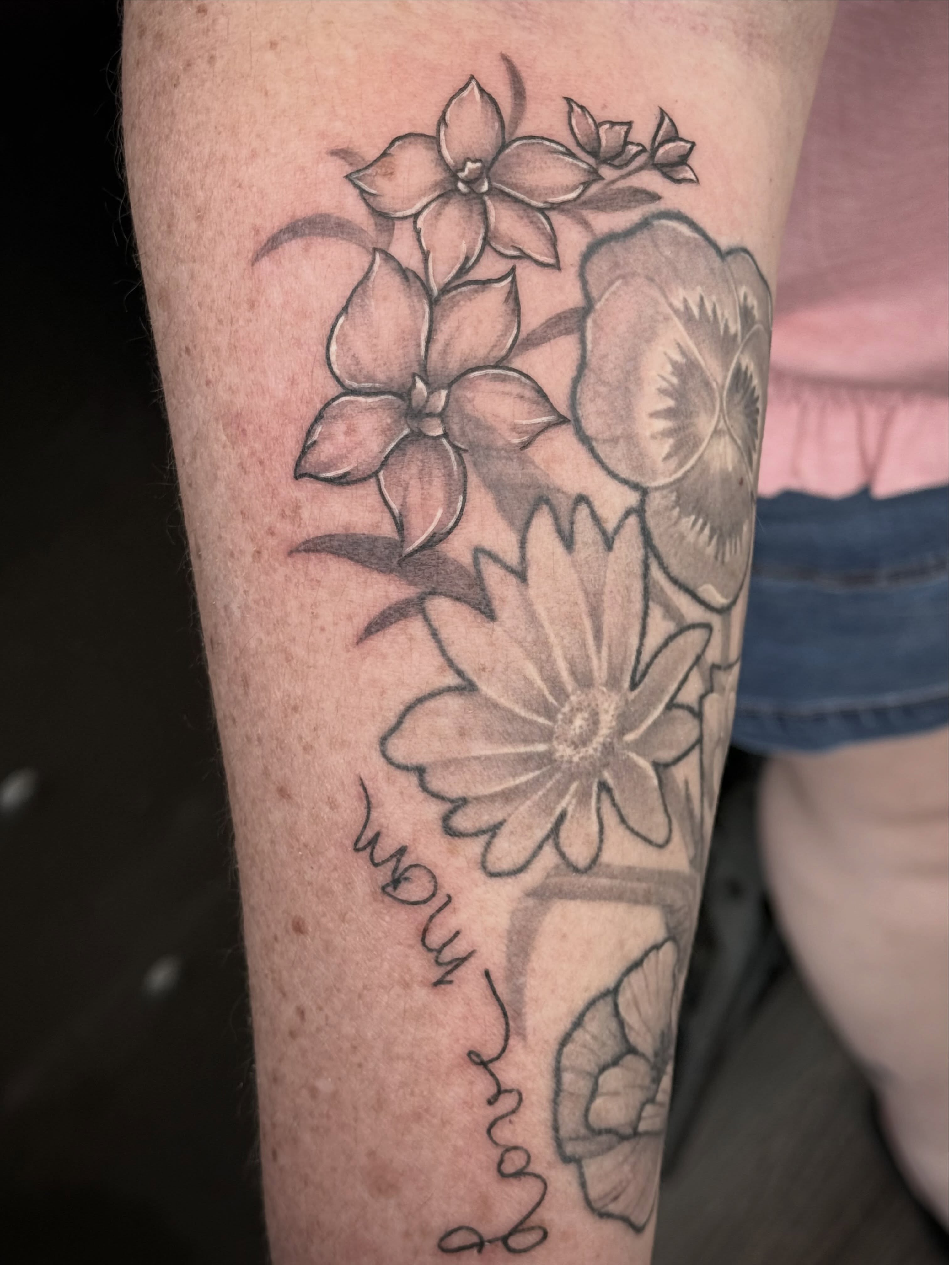 Flowers black and grey tattoo on the forearm by abbie michelle