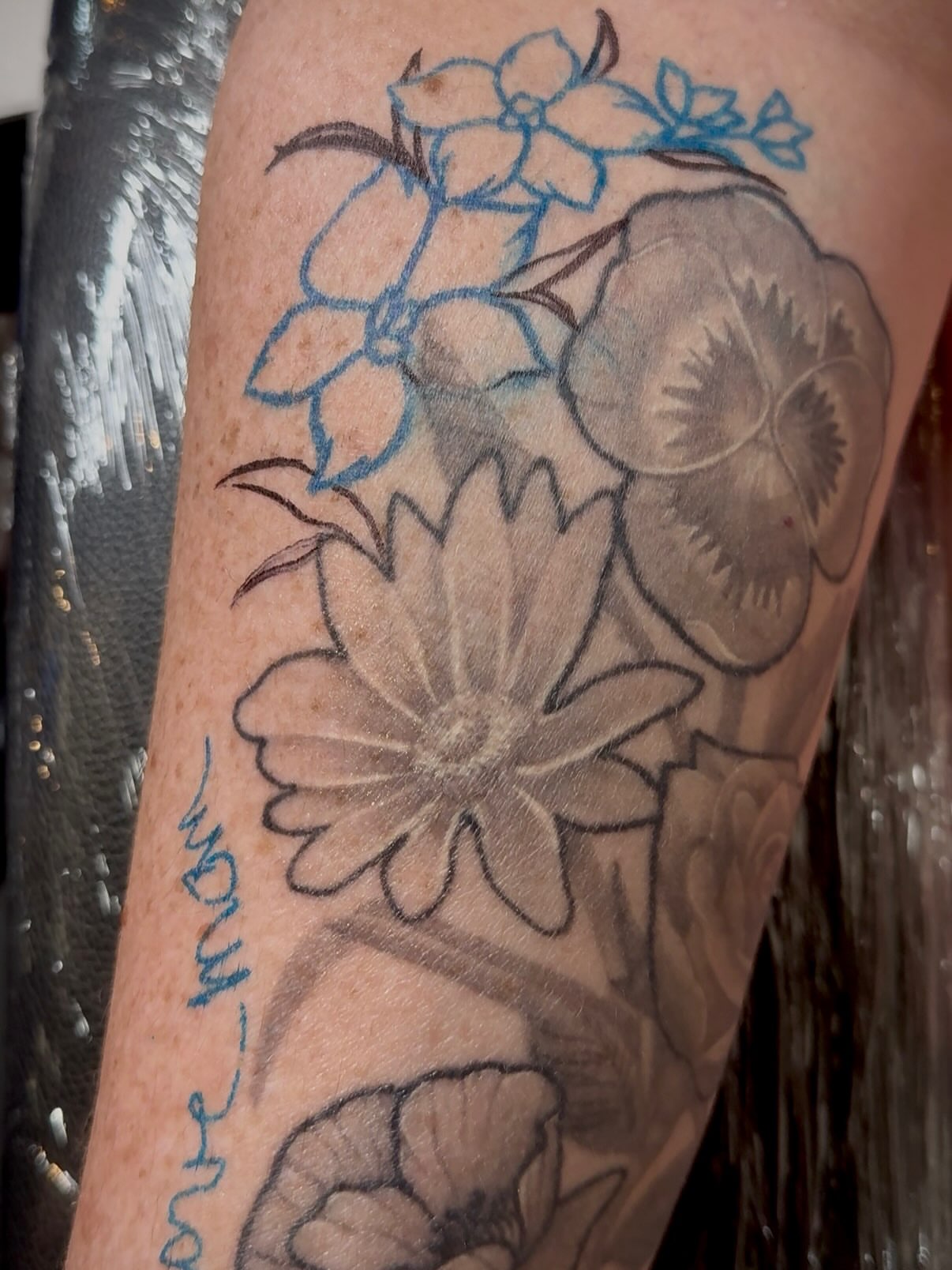 Flowers black and grey tattoo on the forearm by abbie michelle