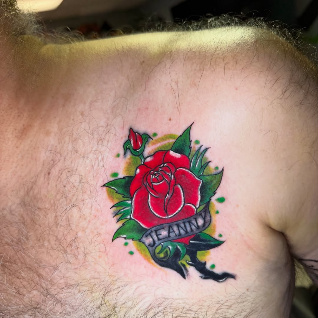Red rose American traditional tattoo on the chest by Steve - Tattoo Artist
