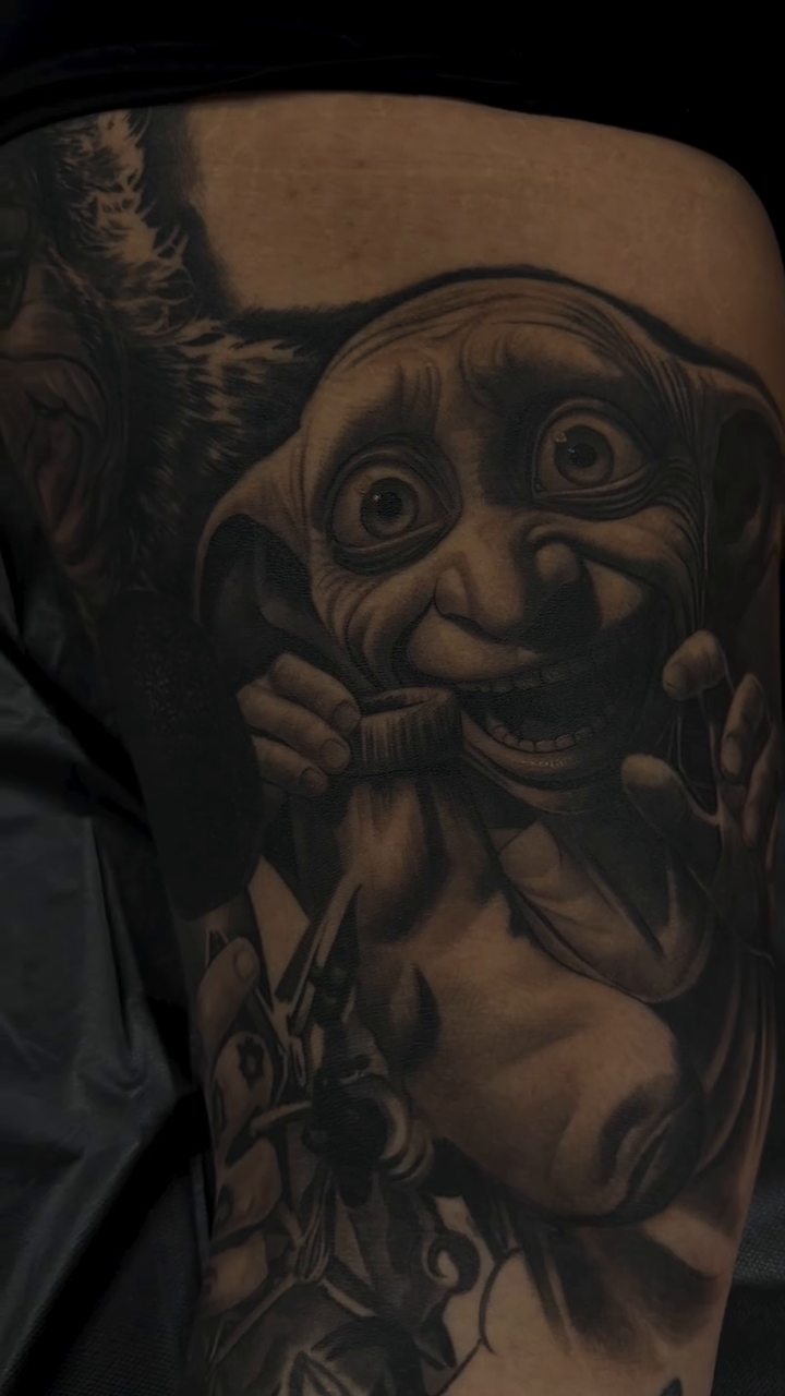 Dobby from Harry Potter realism tattoo on the upper arm by Dillinger, Ventura, California
