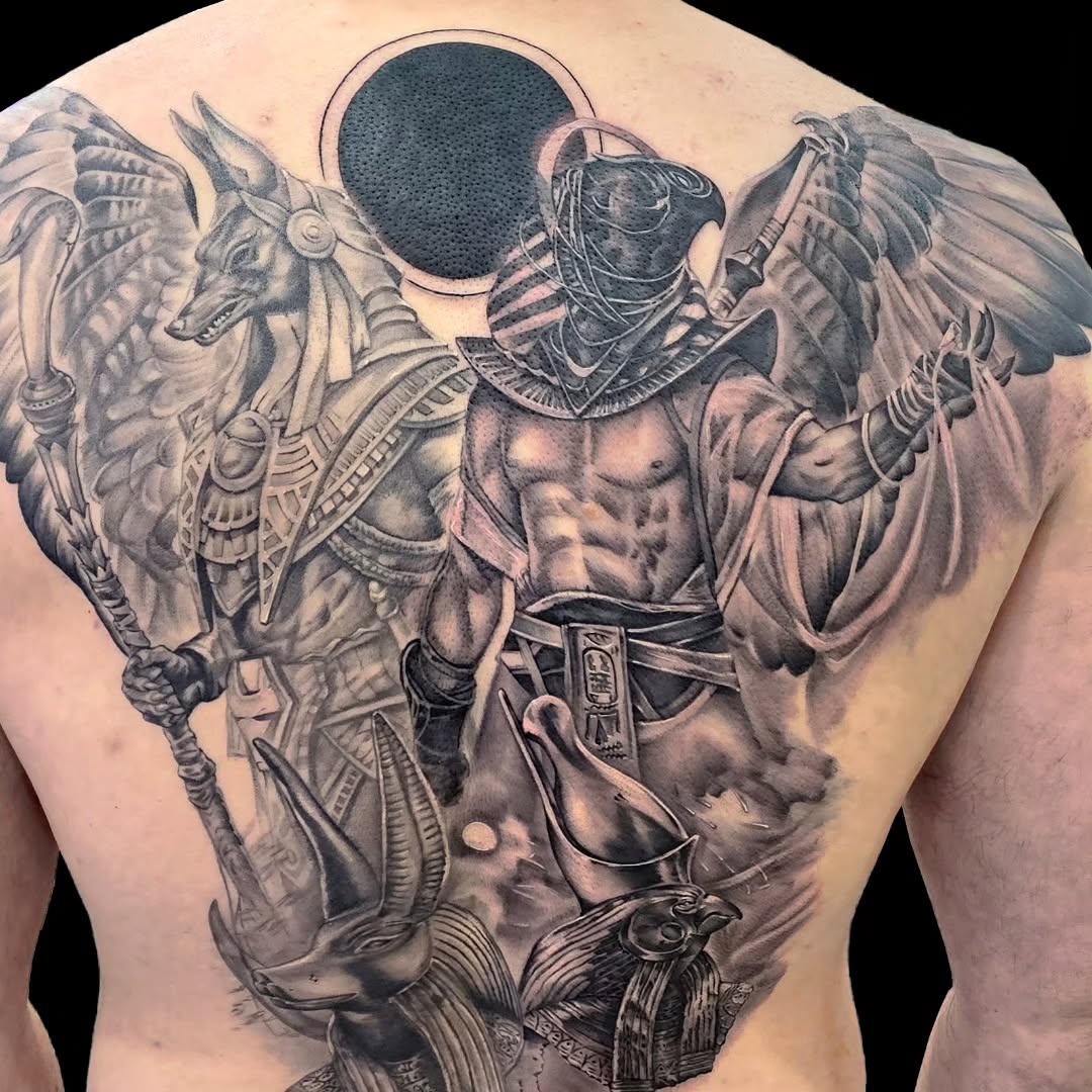 Egyptian gods Anubis and Horus realism tattoo on the back by Dallas Tattoo Artist Erik Espinoza