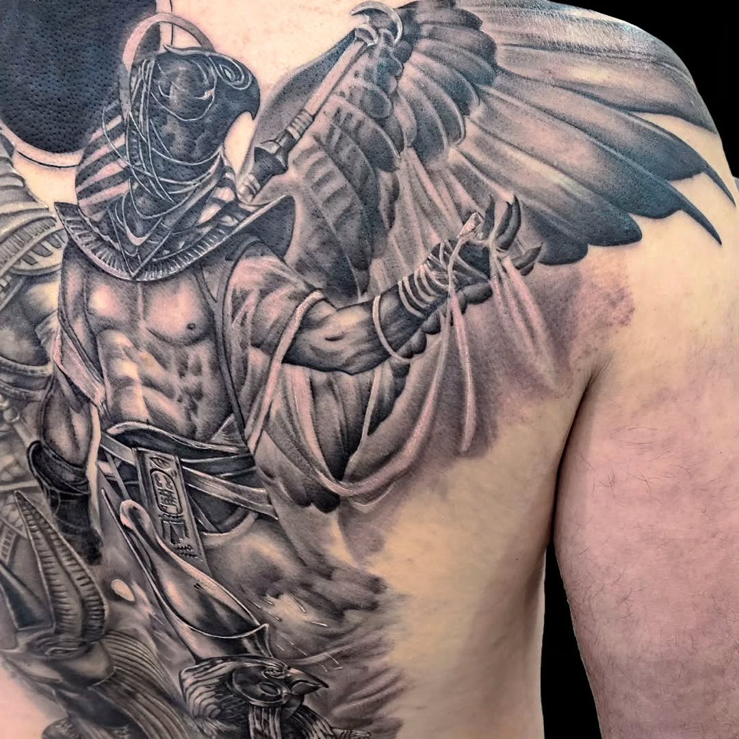 Egyptian deity with wings realism tattoo on the back by Dallas Tattoo Artist Erik Espinoza