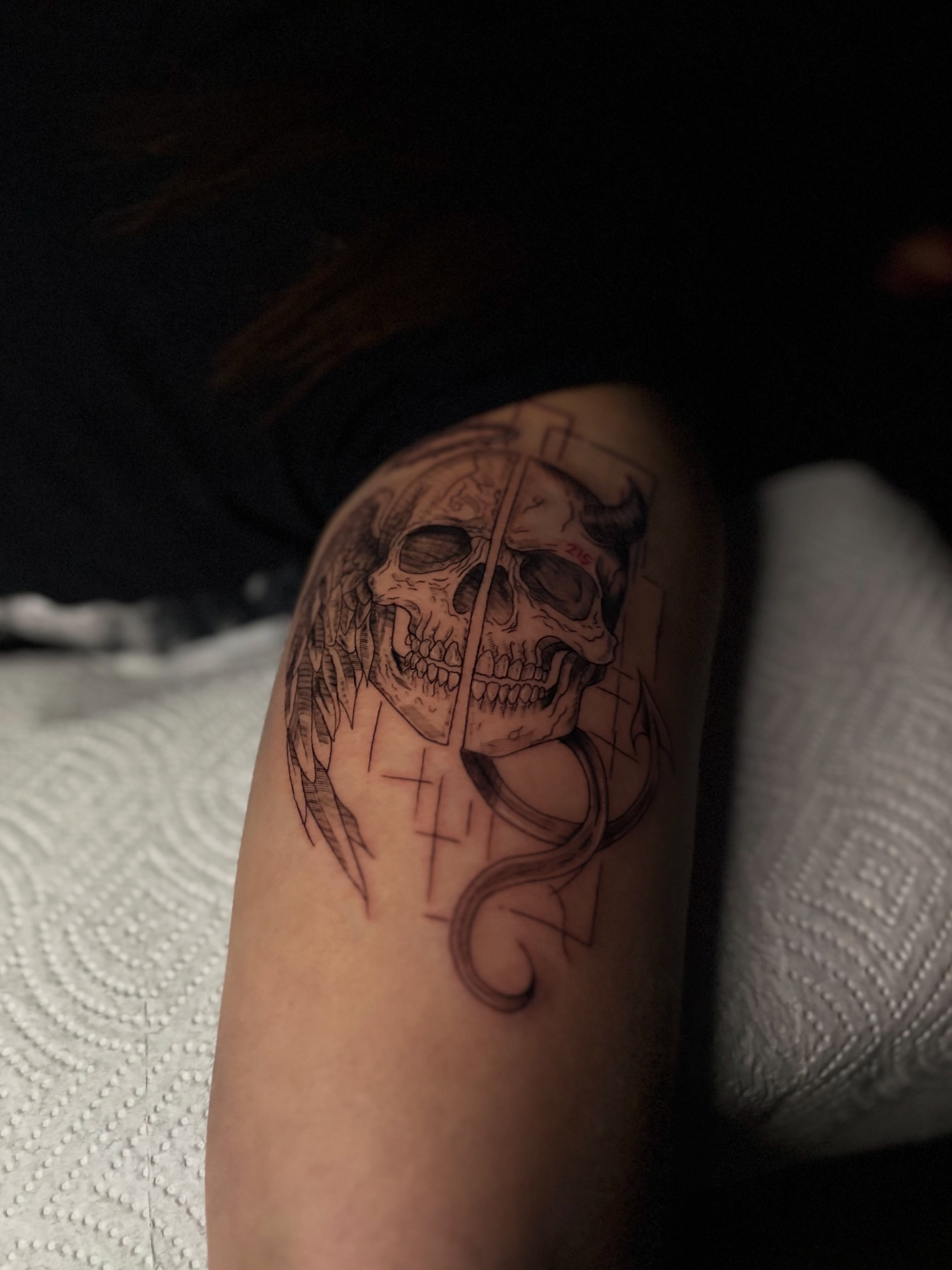 Skull and snake realism tattoo on the forearm by Messias Tattoo Artist