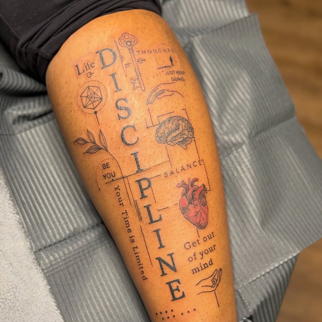 DISCIPLINE with anatomical heart and brain sketch tattoo on the thigh by Chymia Baker