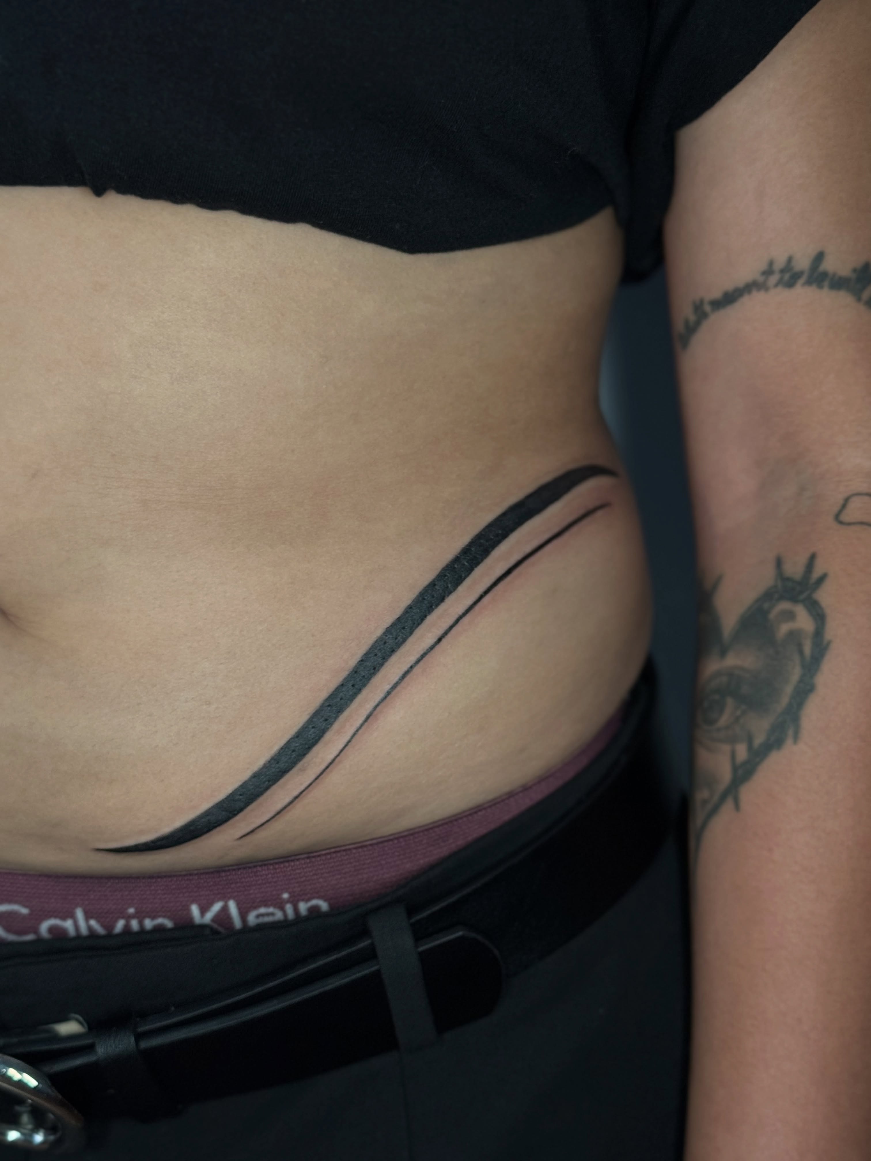 Abstract lines black and grey tattoo on the ribs by 𝕽𝖆𝖈𝖍𝖊𝖑 𝕽𝖆𝖉𝖎𝖈𝖆𝖑 Queens Tattooer