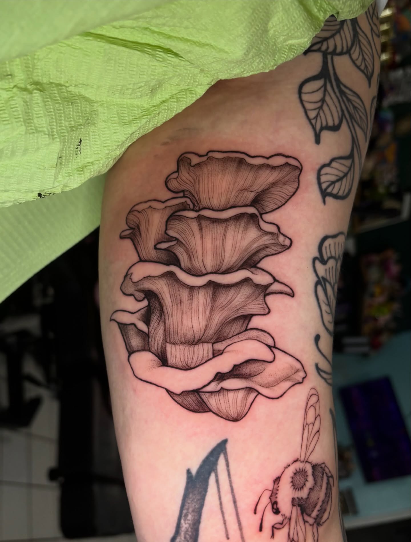 Fungi black and grey tattoo on the forearm by Chloe Shay