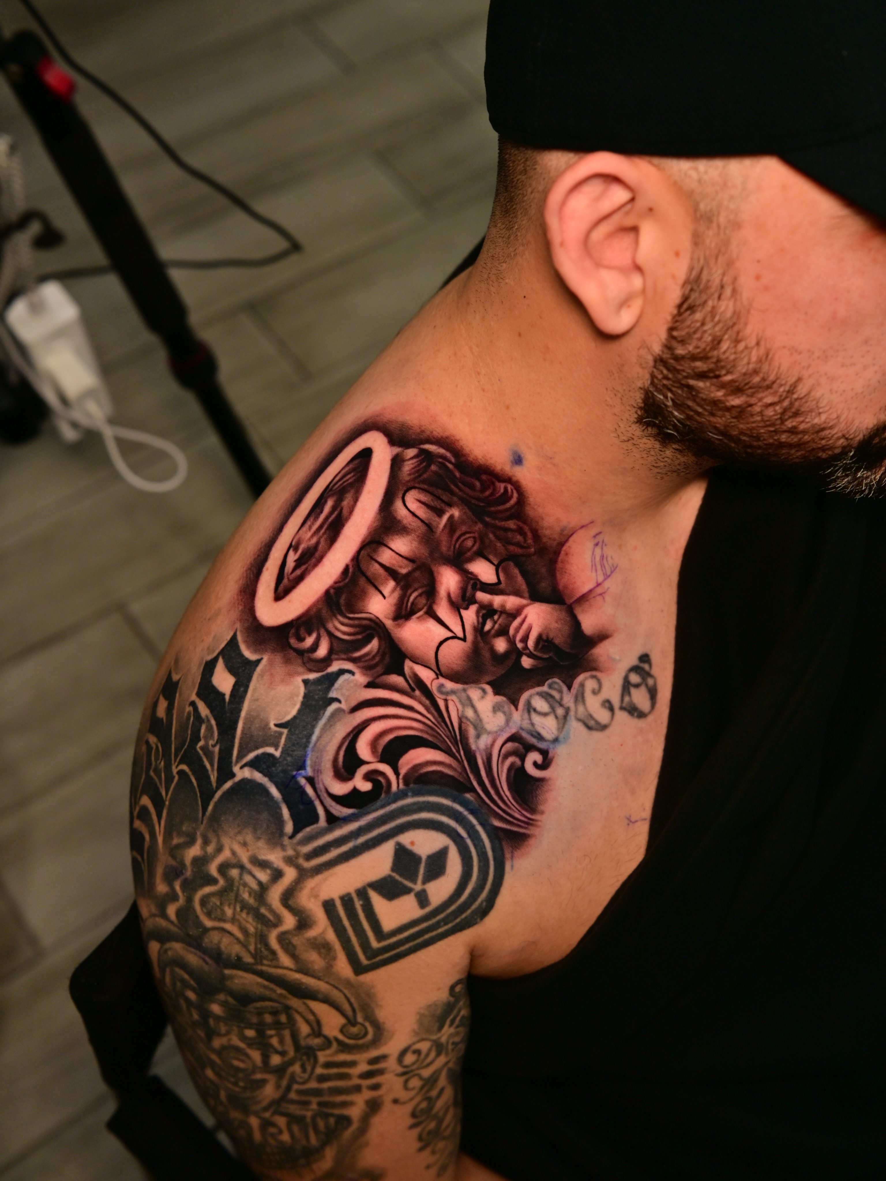 Religious figure American traditional tattoo on the shoulder by Dallas tattoo artist