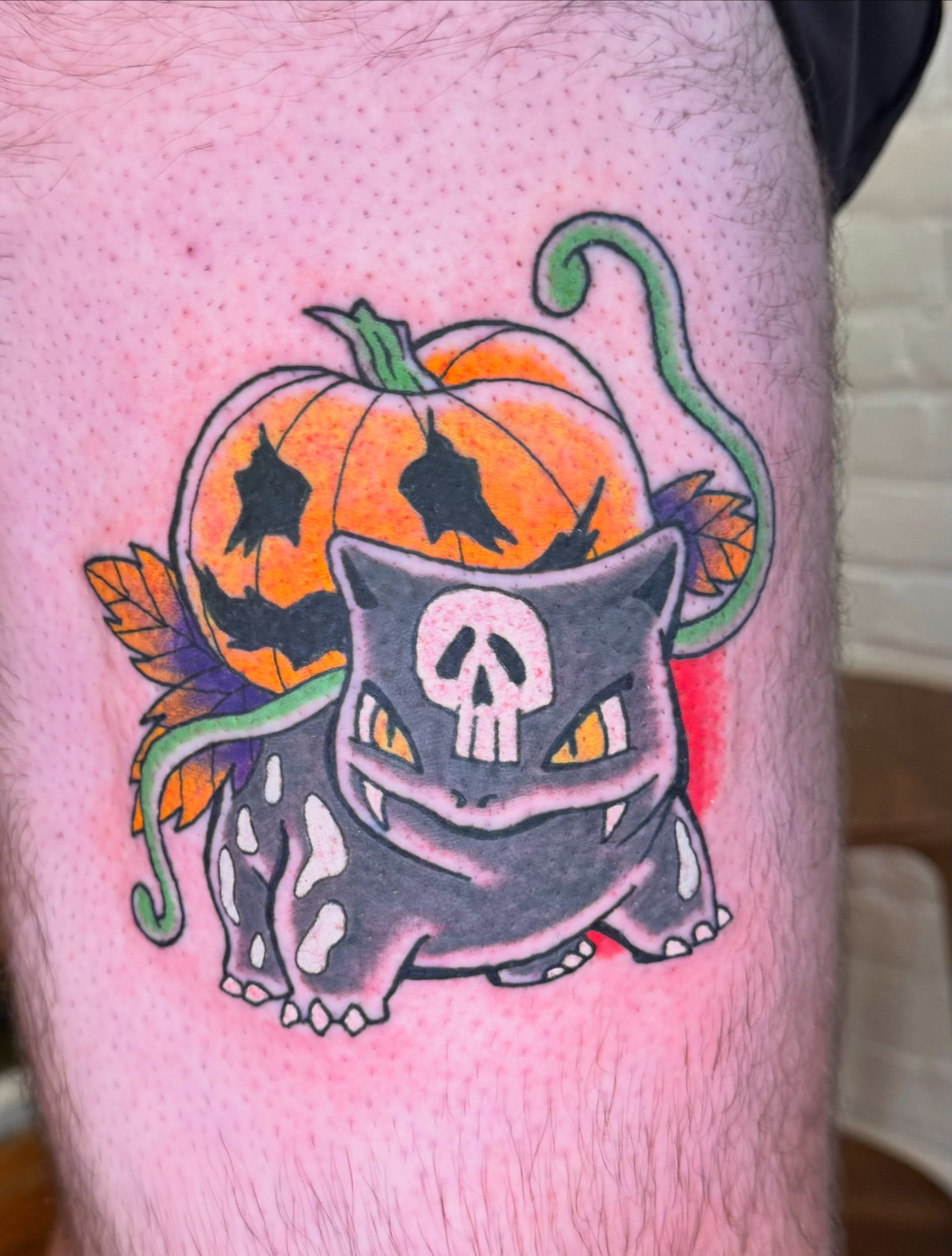 Cat with pumpkin dotwork tattoo on the thigh by Zac Smith-Chevalier