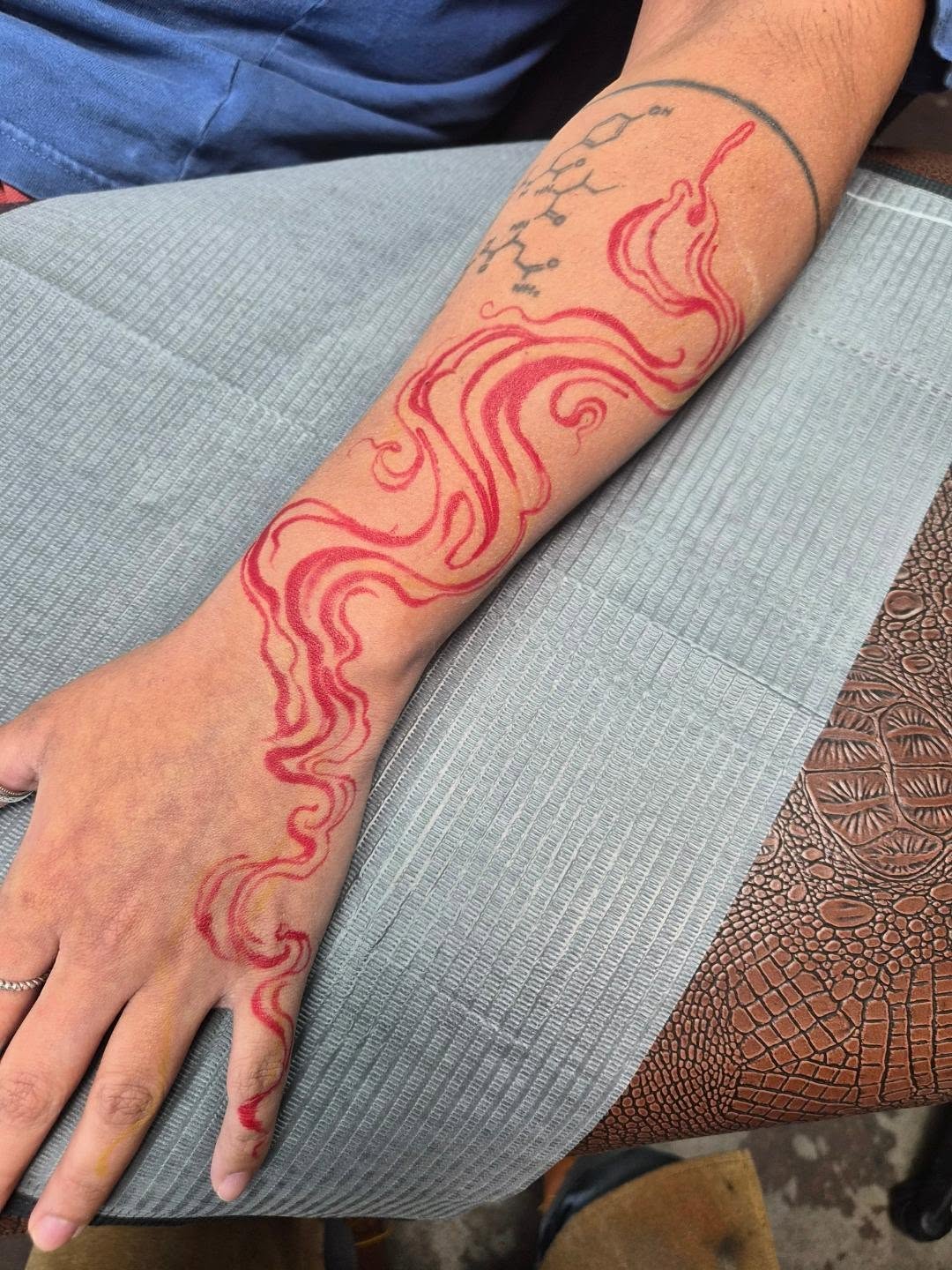 Flame new school tattoo on the forearm by Taylor Popkins
