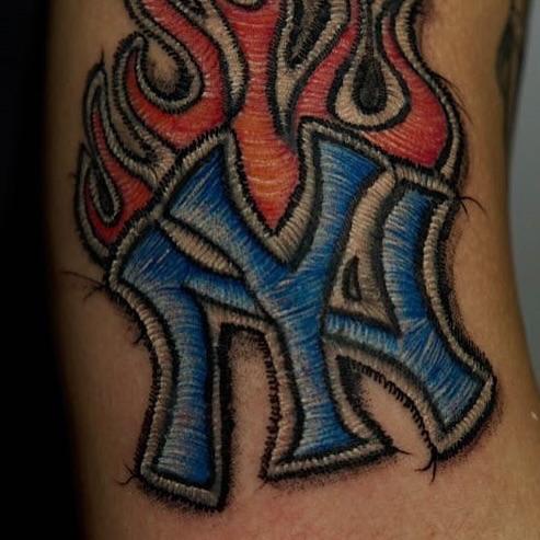 Yankees logo tribal tattoo on the forearm by Fabian Hellberg