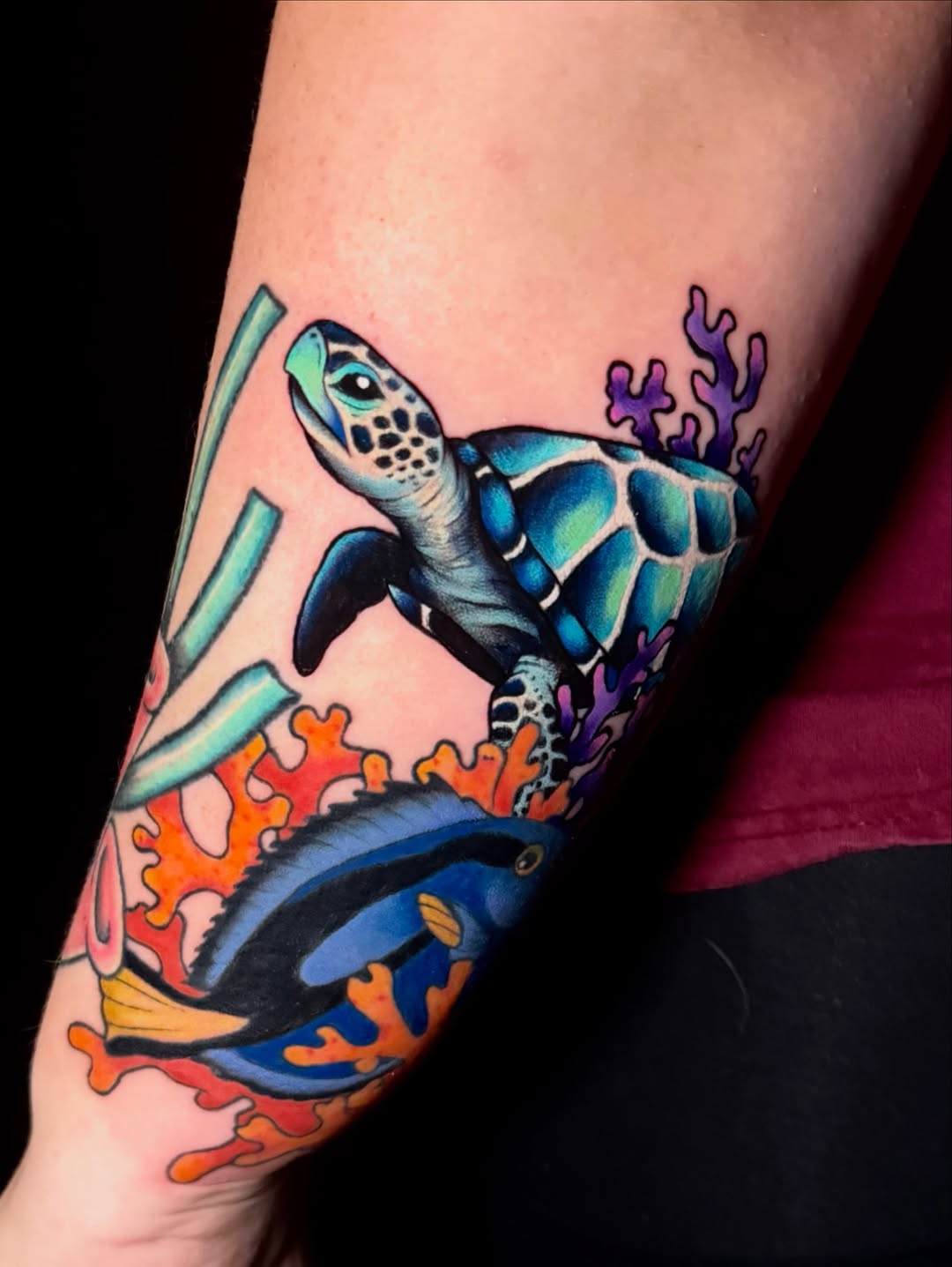 Sea turtle and fish with coral watercolor tattoo on the forearm by Taylor Kay 🌿
