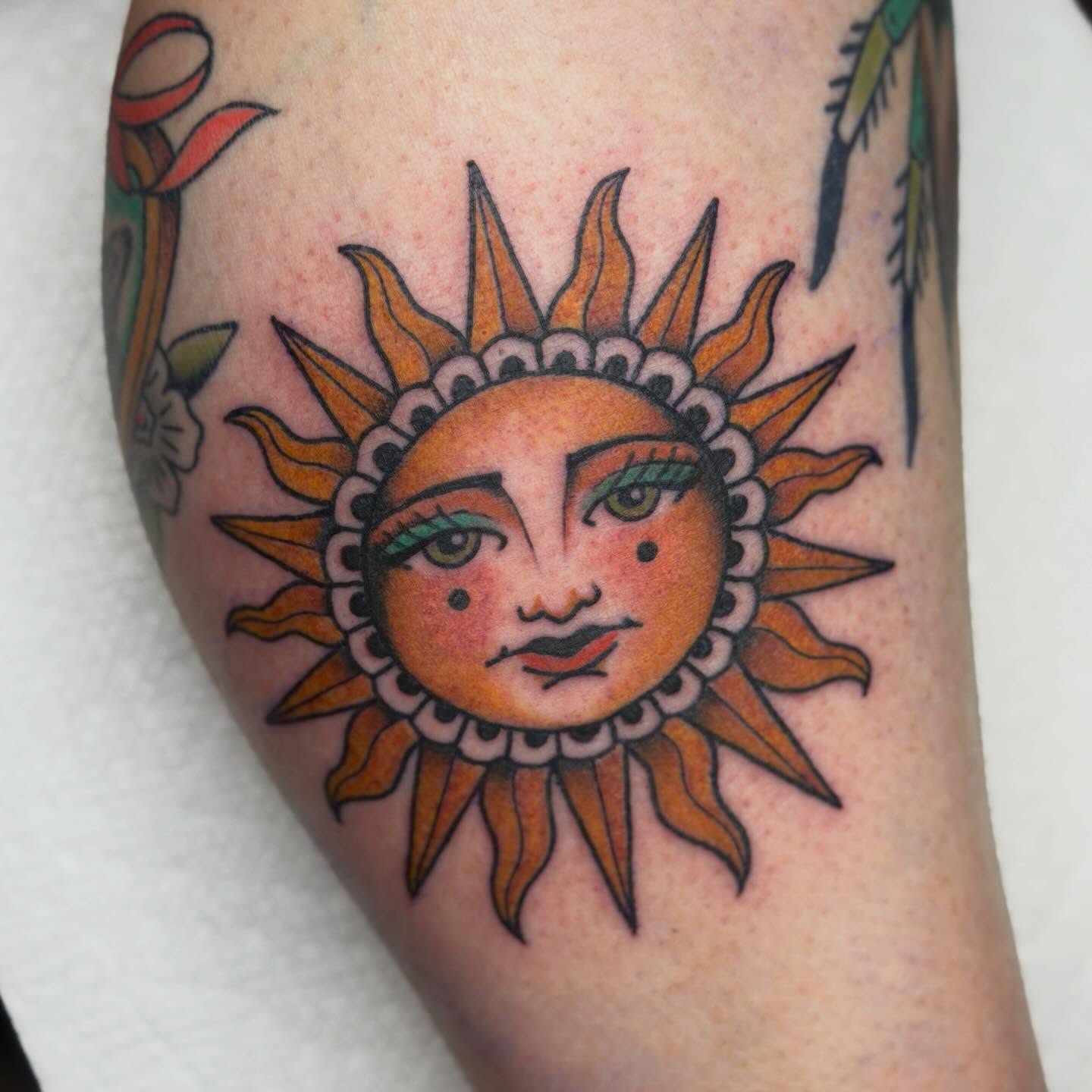 Sun American traditional tattoo on the forearm by Jenna Szerszen-Wynn ๐