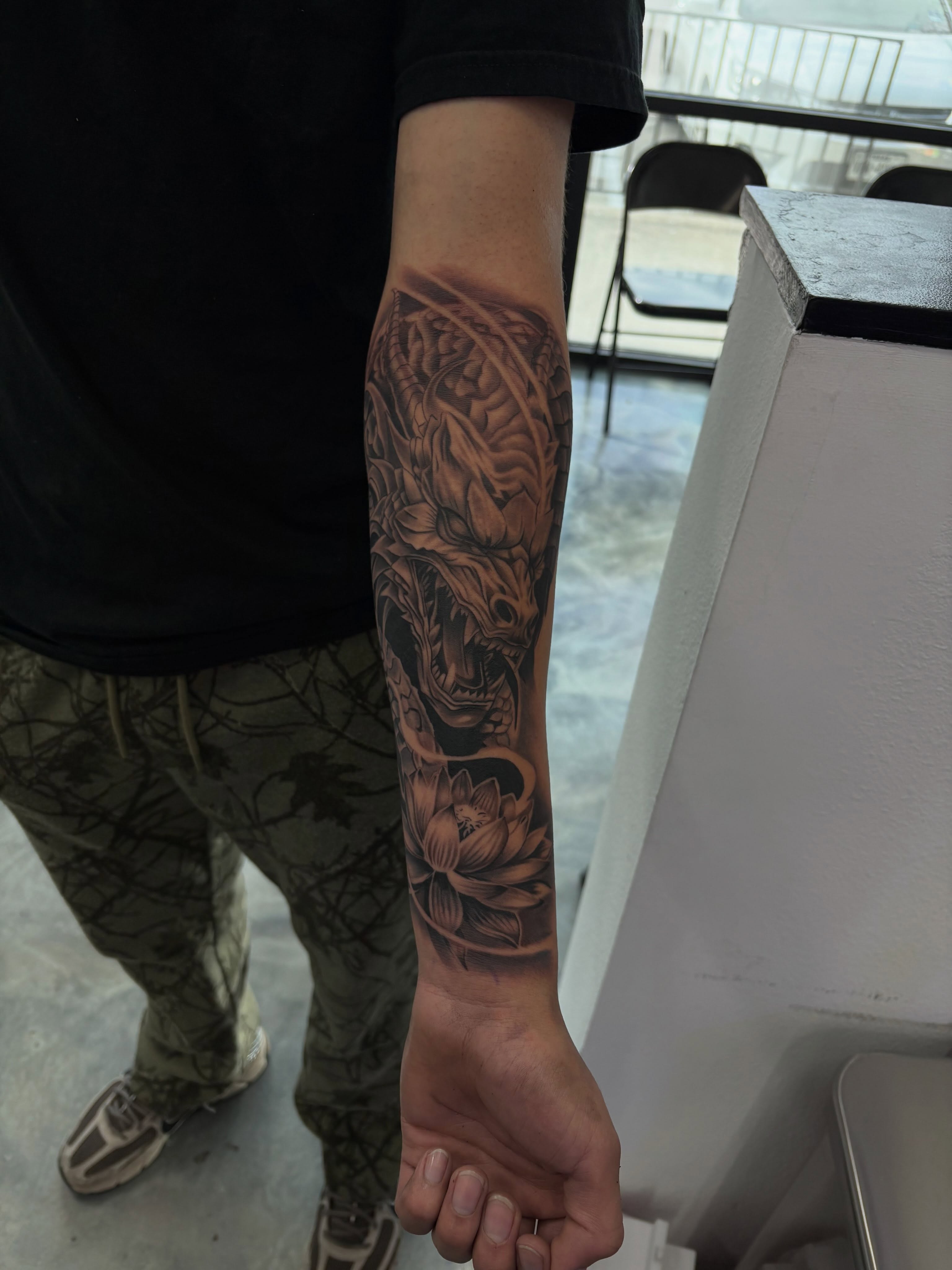 Dragon and lotus japanese irezumi tattoo on the forearm by Devin